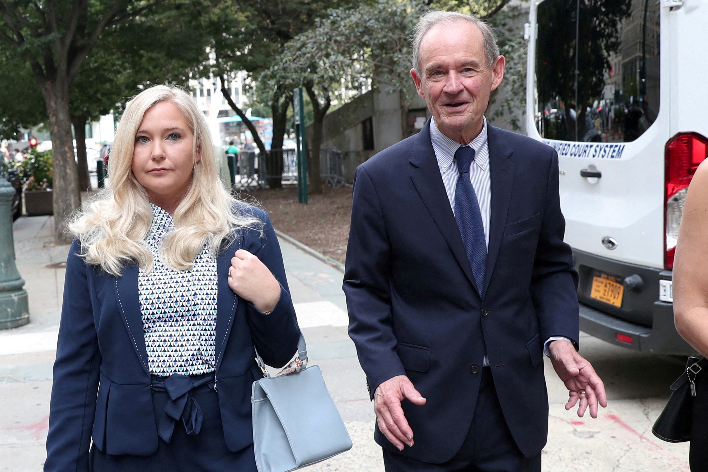 Lawyer David Boies arrives with his client Virginia Giuffre for a hearing in the criminal case against Jeffrey Epstein in New York, 2019.