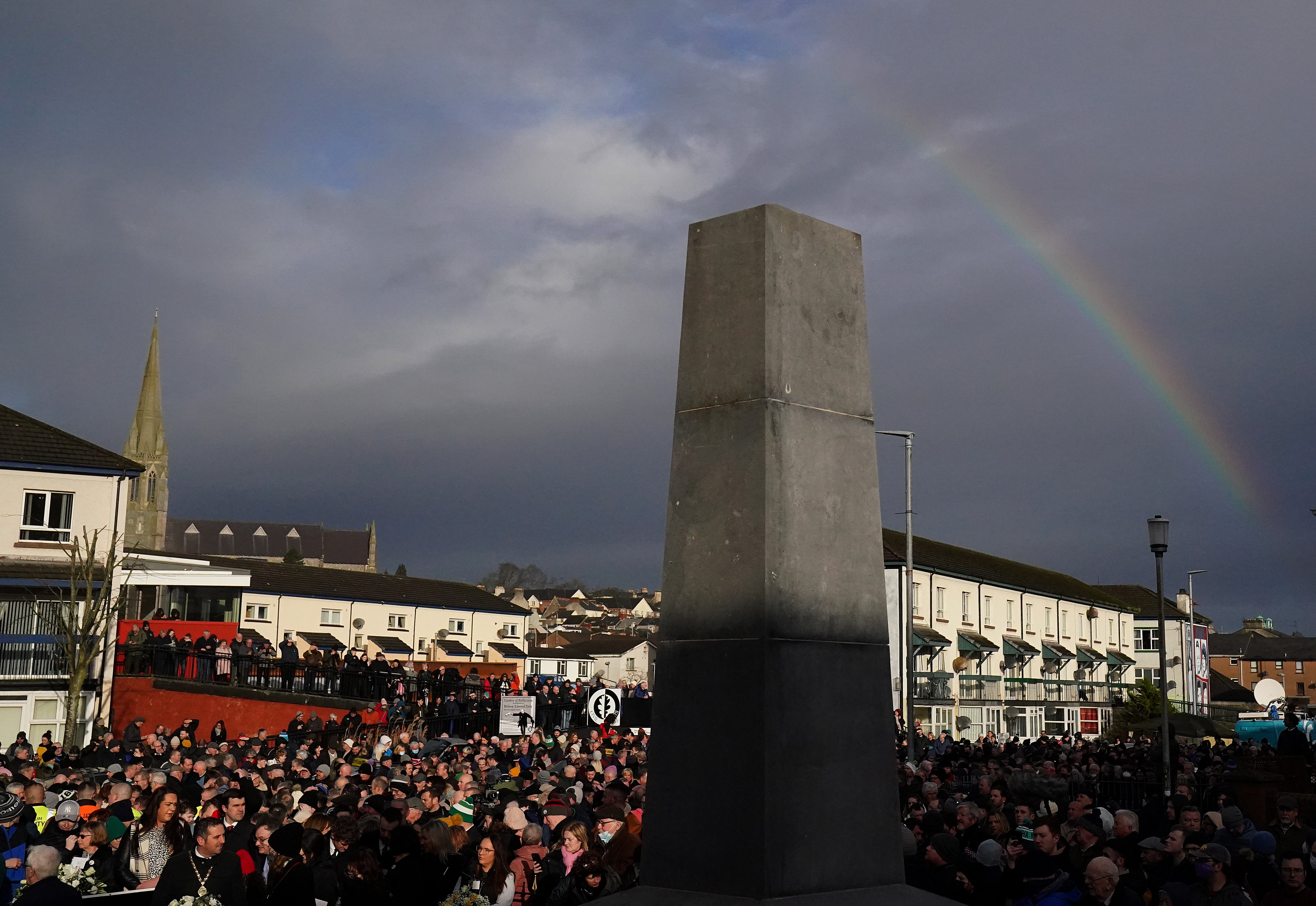 A rainbow is seen above the Bloody Sunday Memorial in Derry as people gather to mark the 50th anniversary of Bloody Sunday (PA)