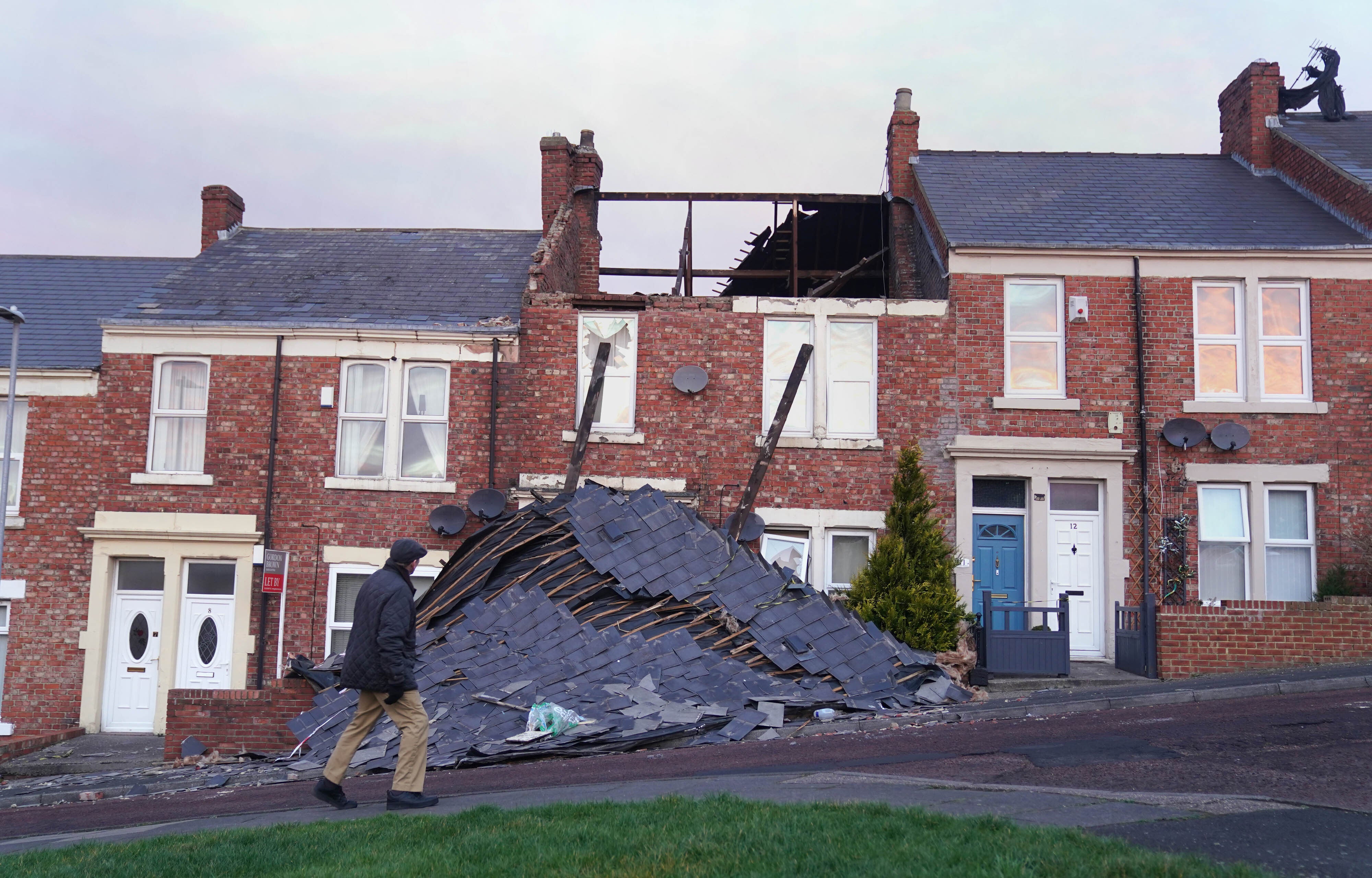 A house in Bensham, Gateshead, which lost its roof after strong winds from Storm Malik battered northern parts of the UK (Owen Humphreys/PA)