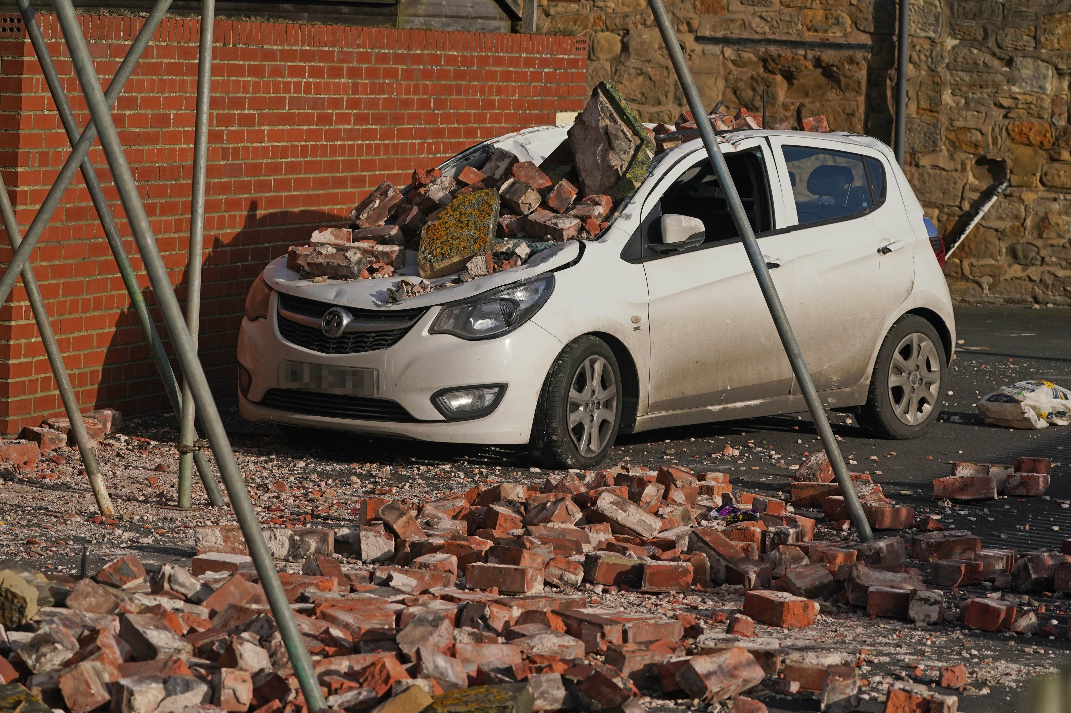 A car crushed by fallen bricks in Seaton Sluice, Northumberland