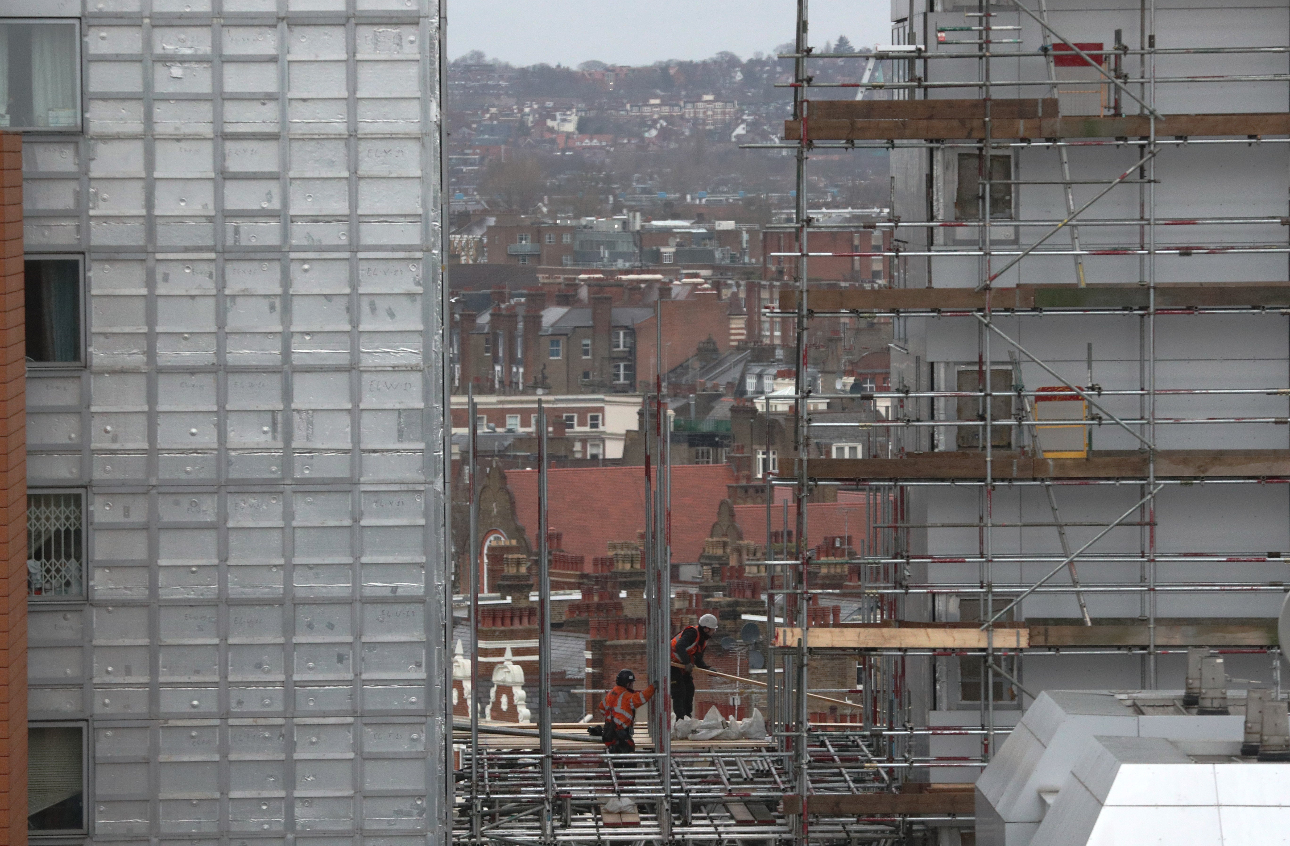 Contractors undertake work at a residential property in Paddington, London, as part of a project to remove and replace non-compliant cladding (PA)