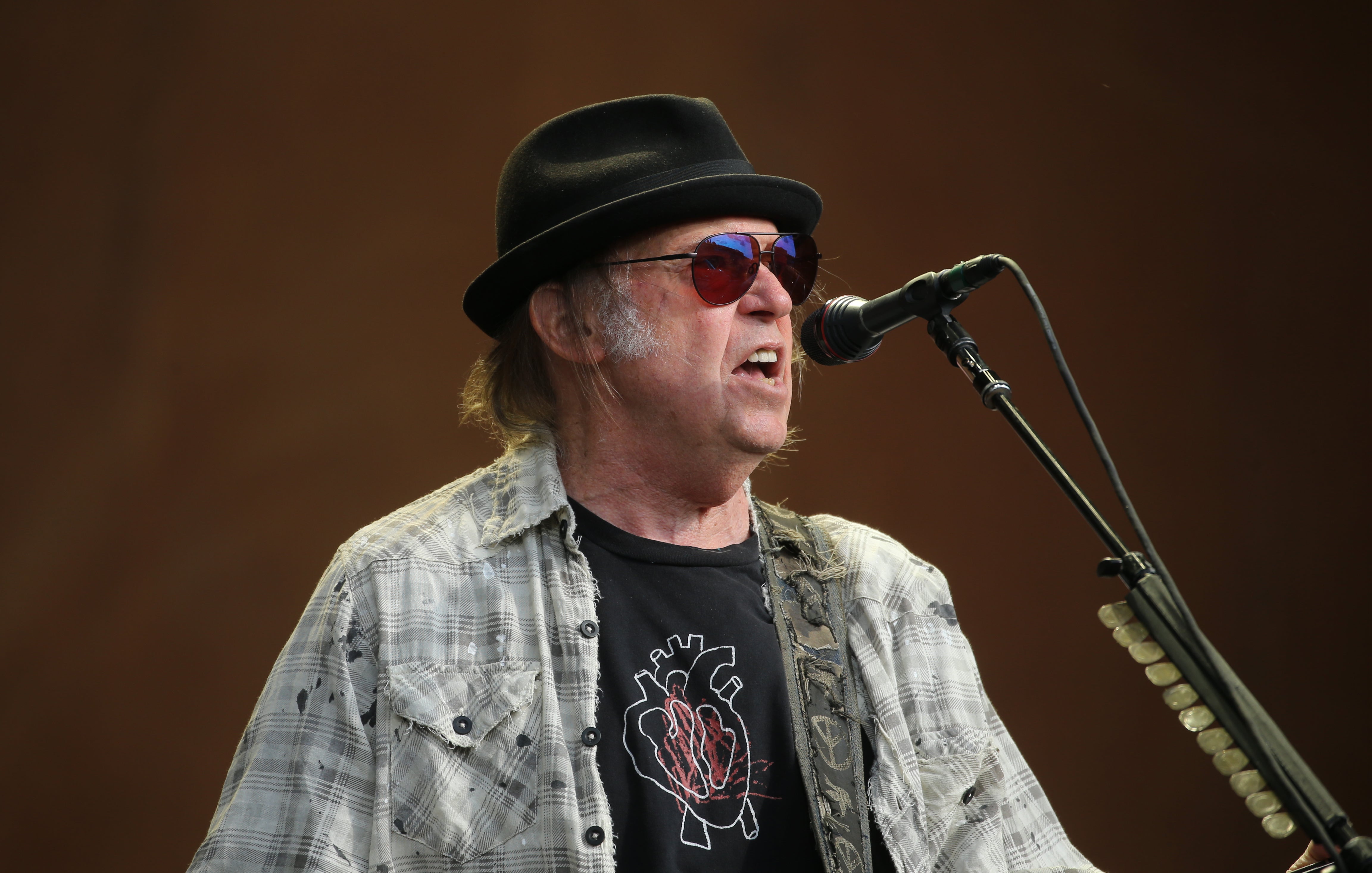 Neil Young accused Spotify of ‘spreading false information about vaccines – potentially causing death’ by hosting The Joe Rogan Experience podcast (Isabel Infantes/PA).