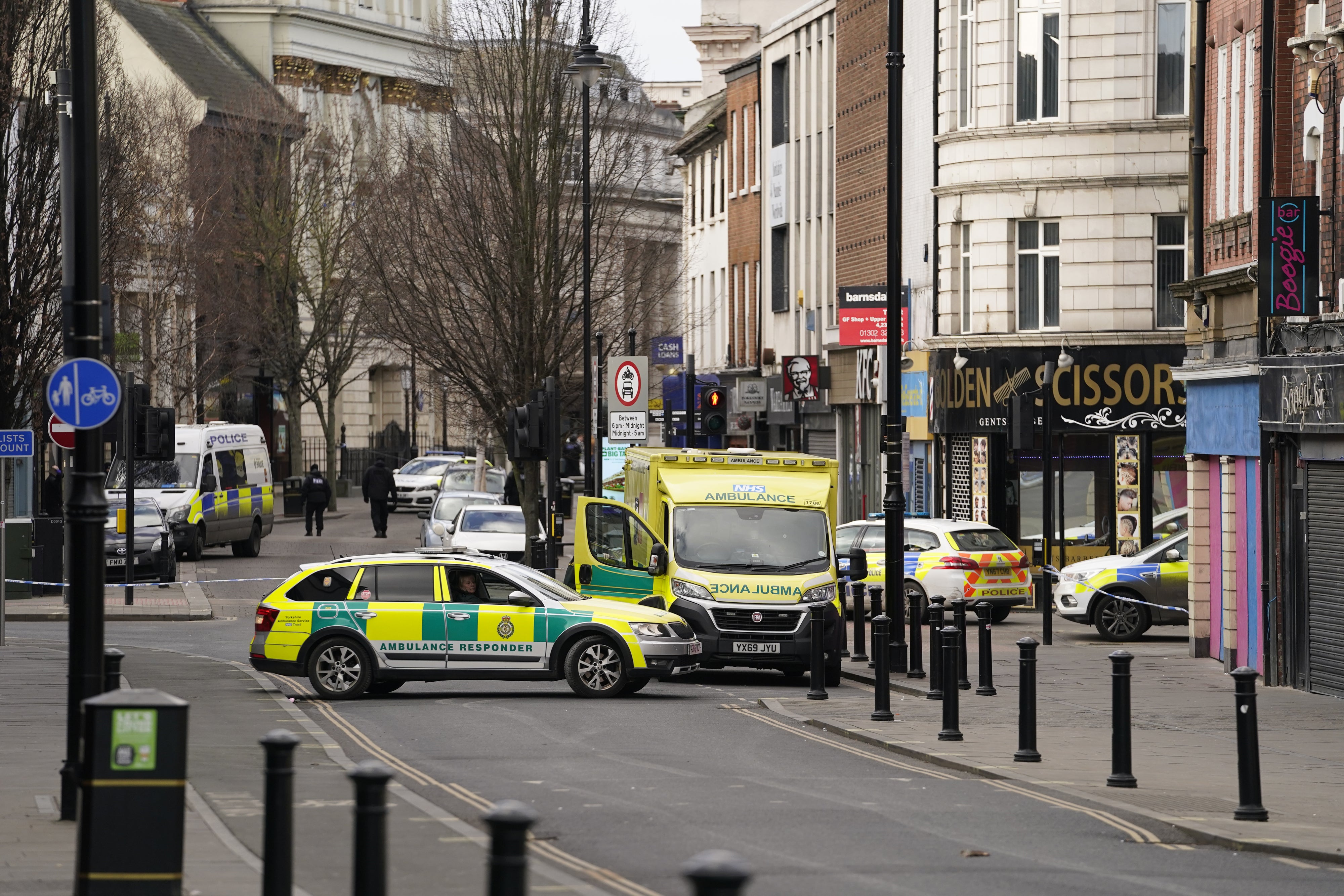 Emergency services in Hall Gate, Doncaster, after a young man and a teenager were stabbed to death (Danny Lawson/PA)