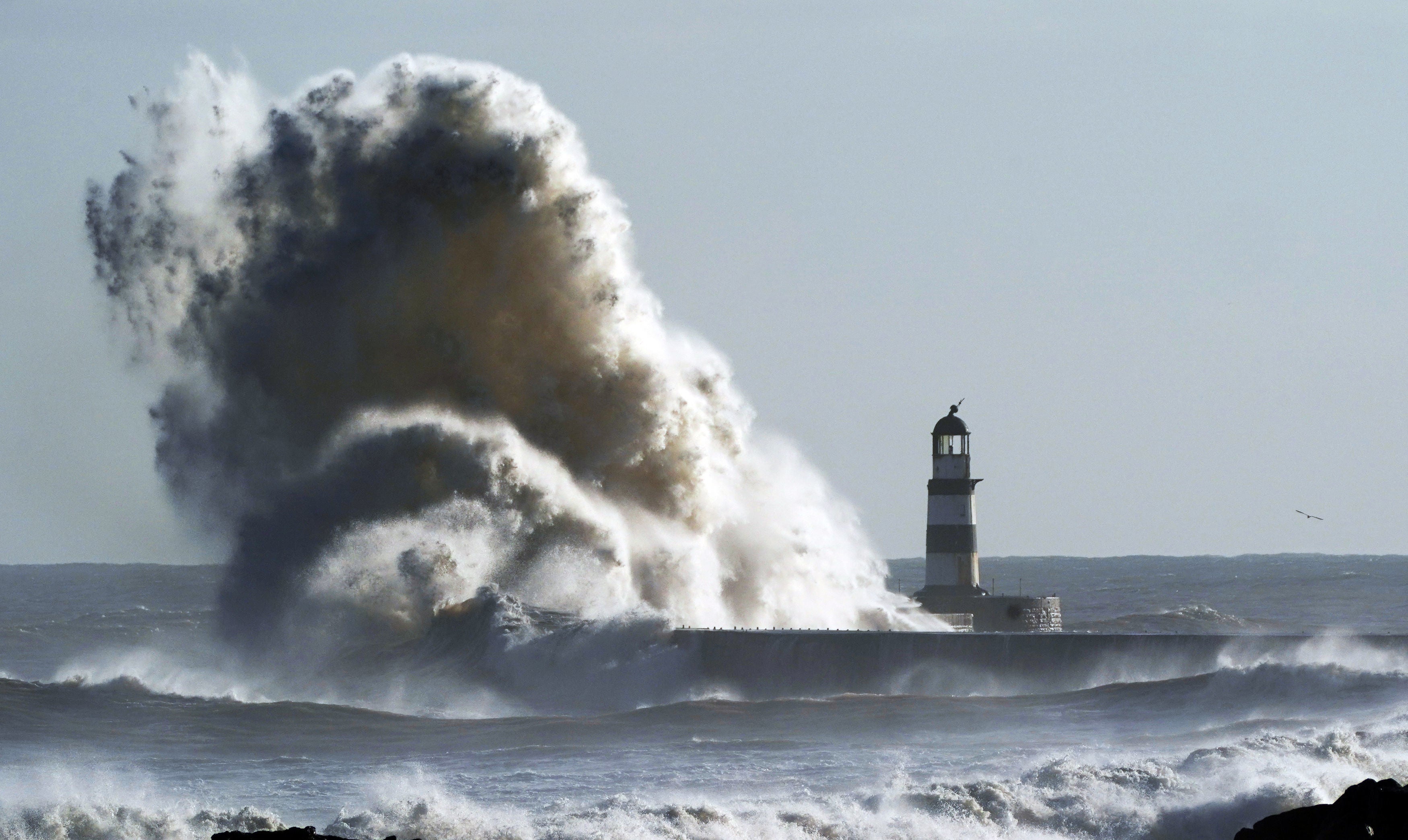 Waves crash against the lighthouse in Seaham Harbour, County Durham after a stormy weekend