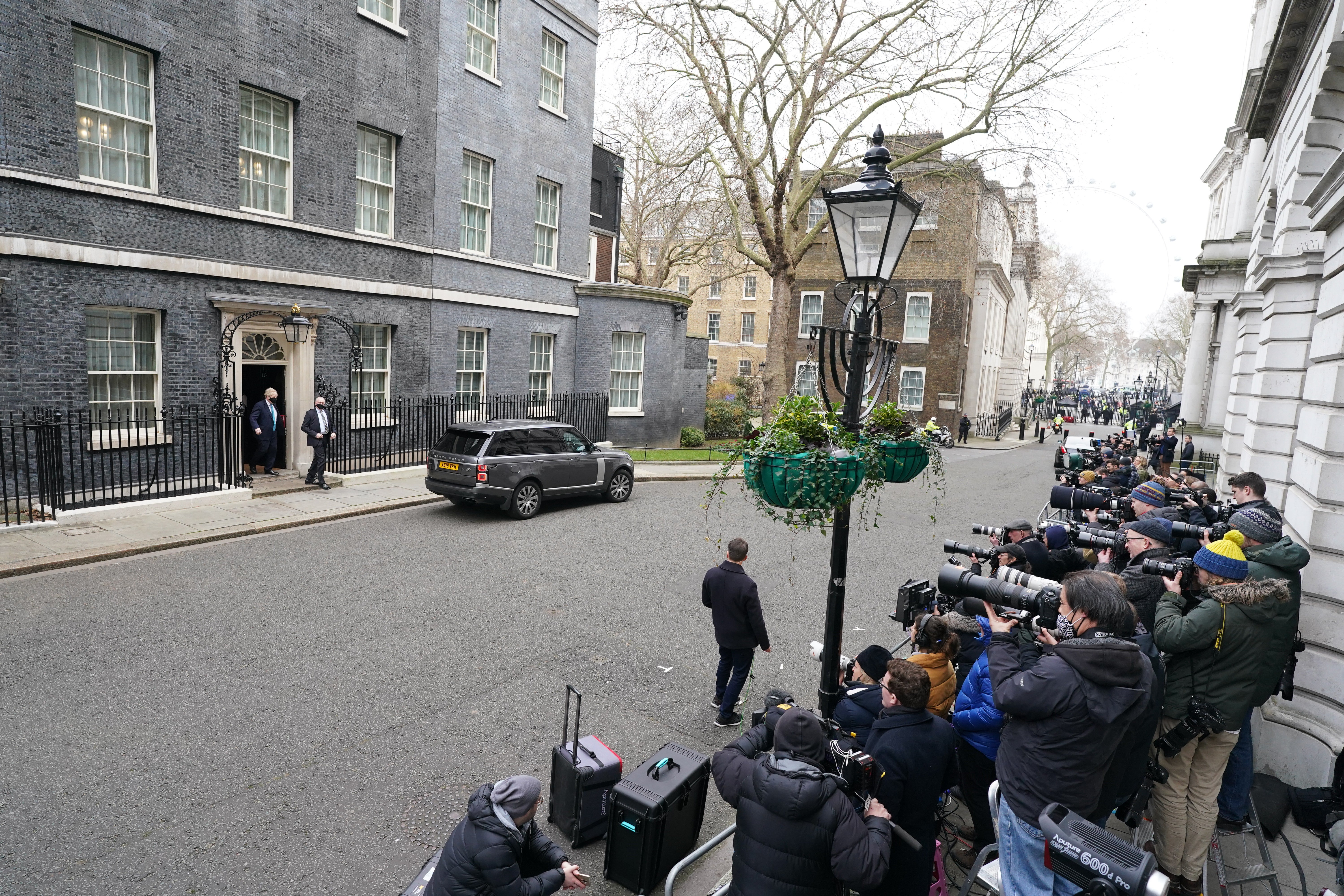 The gathered media capture Prime Minister Boris Johnson leaving 10 Downing Street (PA)