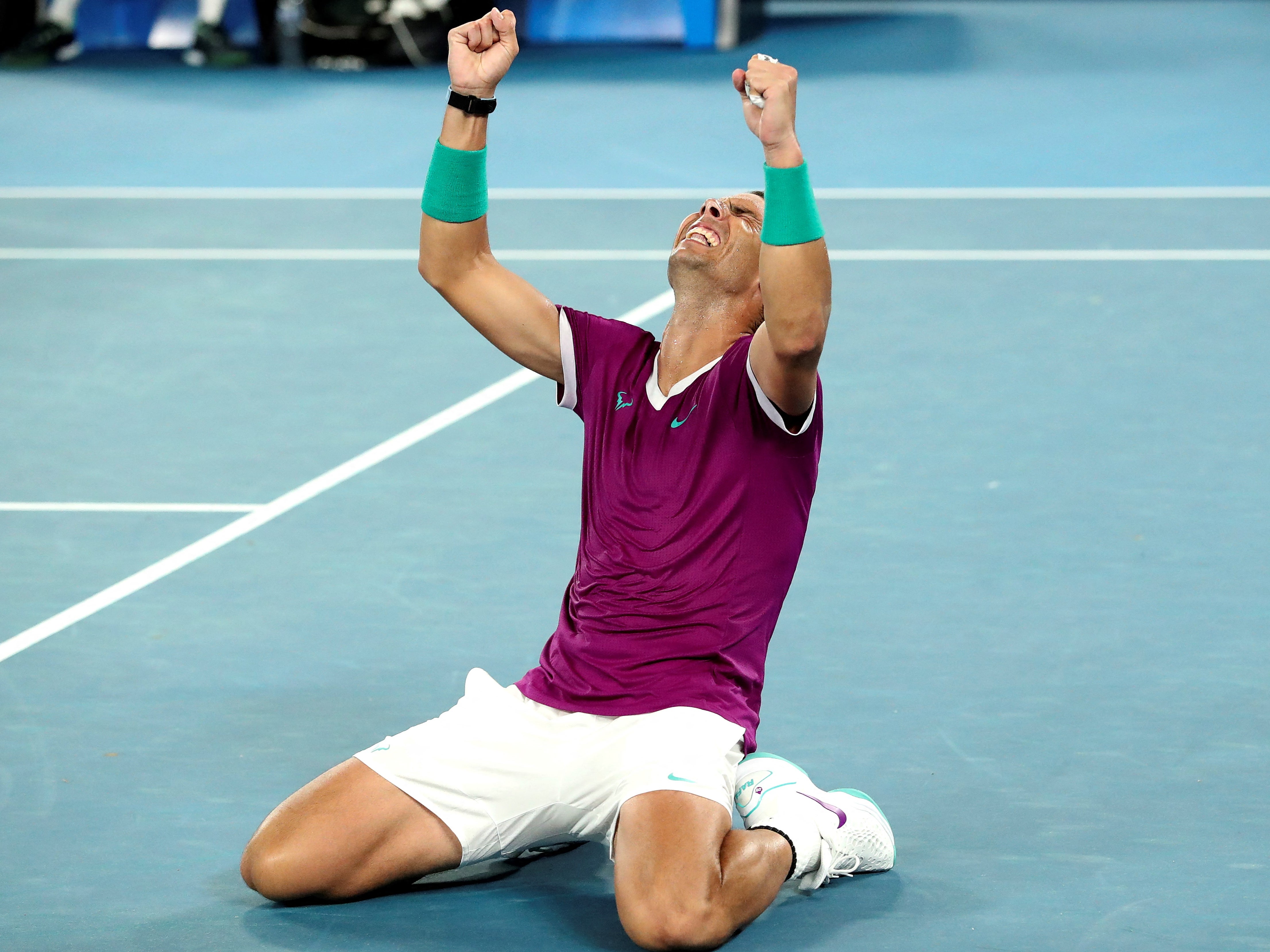 Rafael Nadal celebrates winning his 21st grand slam