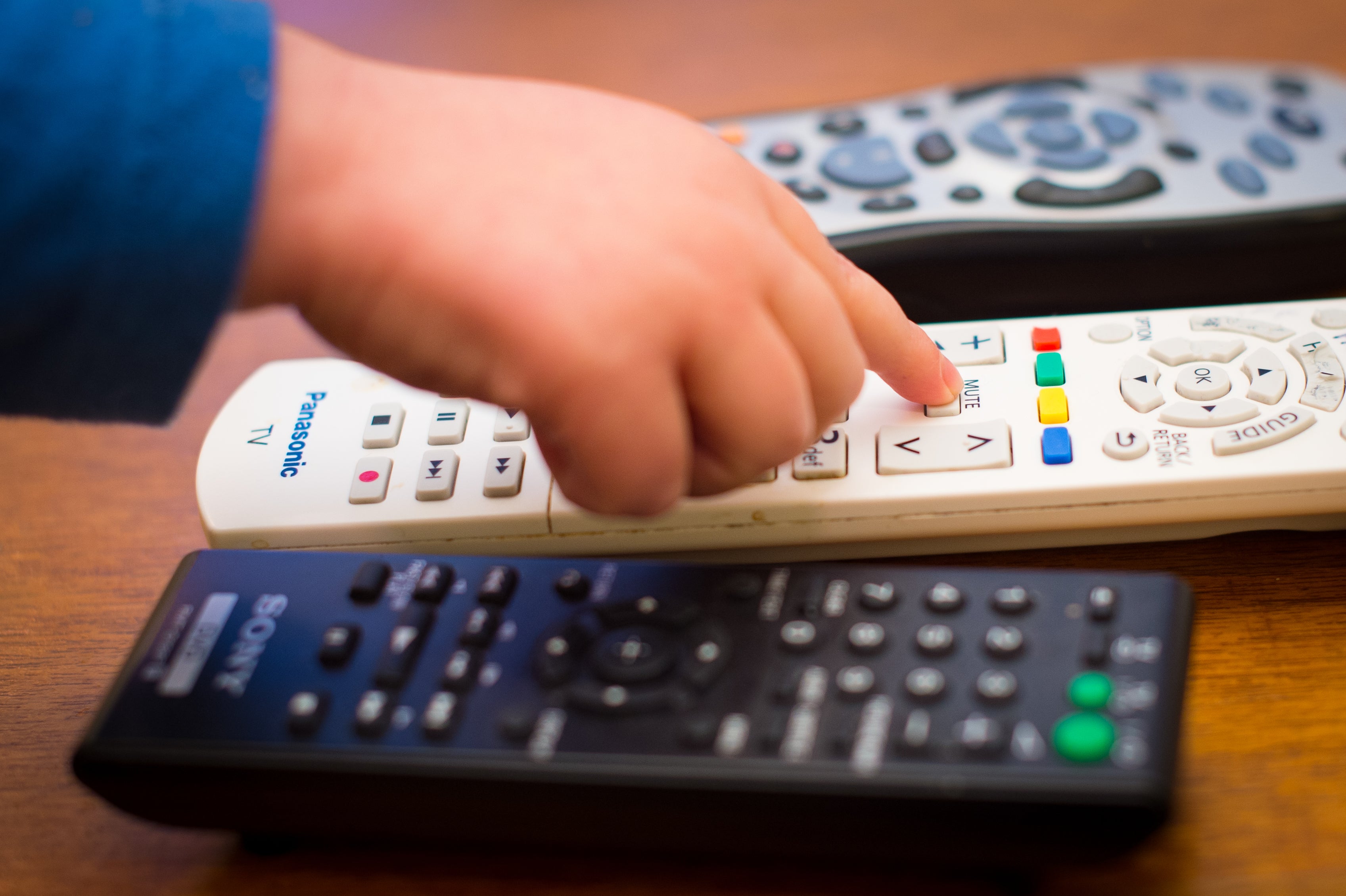 Child using a remote control (Dominic Lipinski/PA)