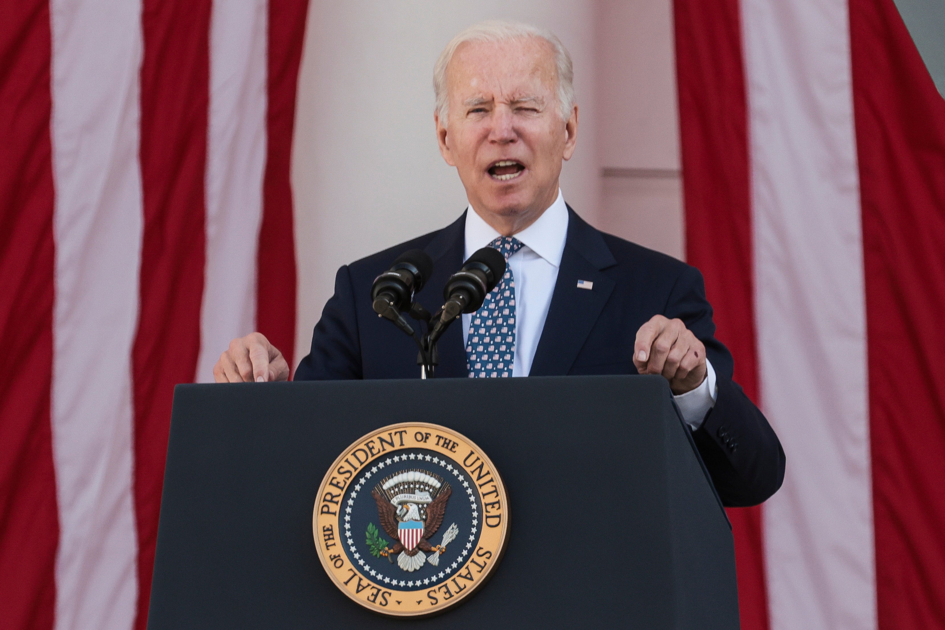 President Joe Biden speaking at Arlington National Cemetery on Veterans Day where he vowed that veterans suffering from exposure to burn pits would have their healthcare covered