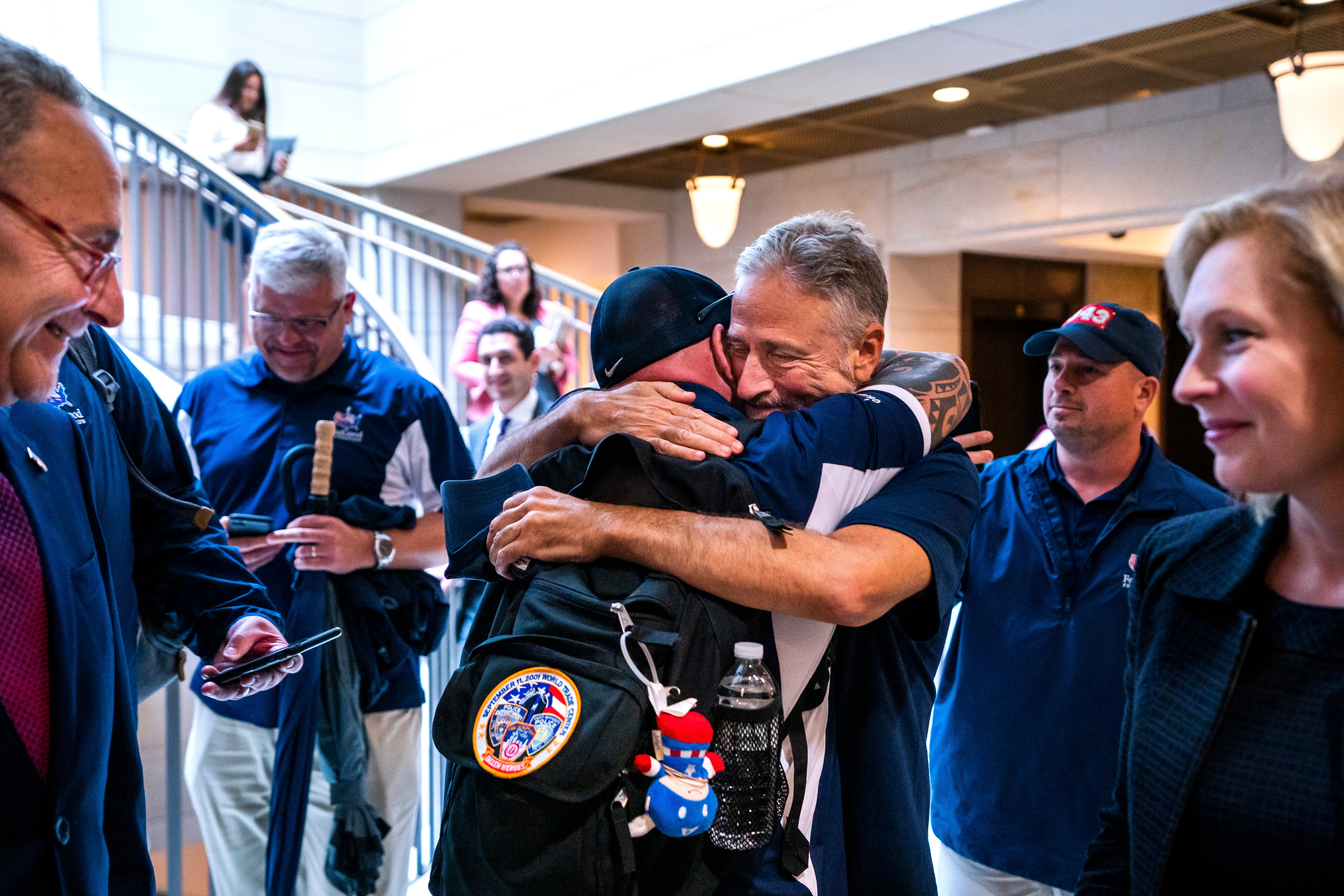 Jon Stewart and John Feal hug after the Senate passes the 9/11 Compensation fund in 2019