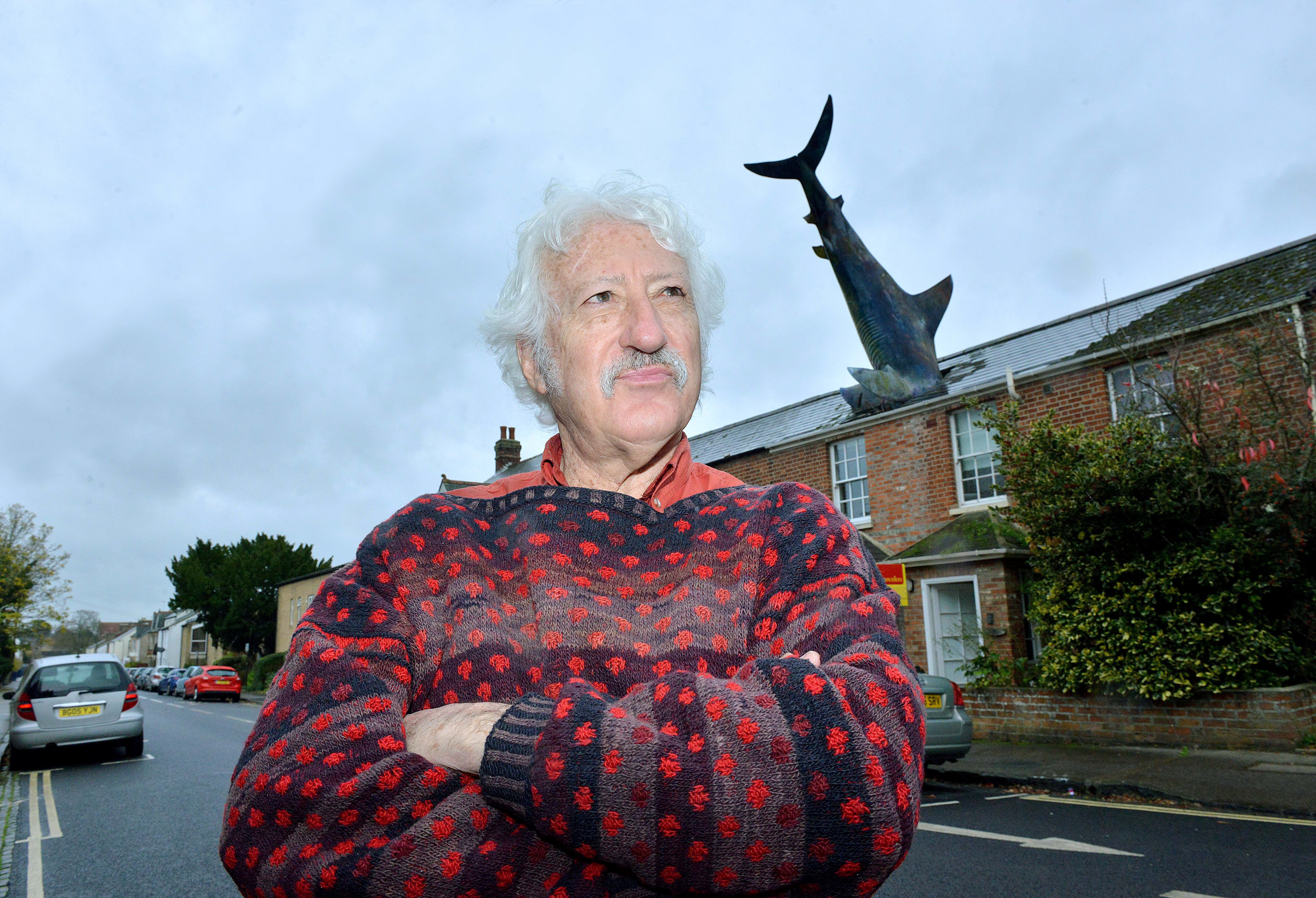 Bill Heine outside his infamous house