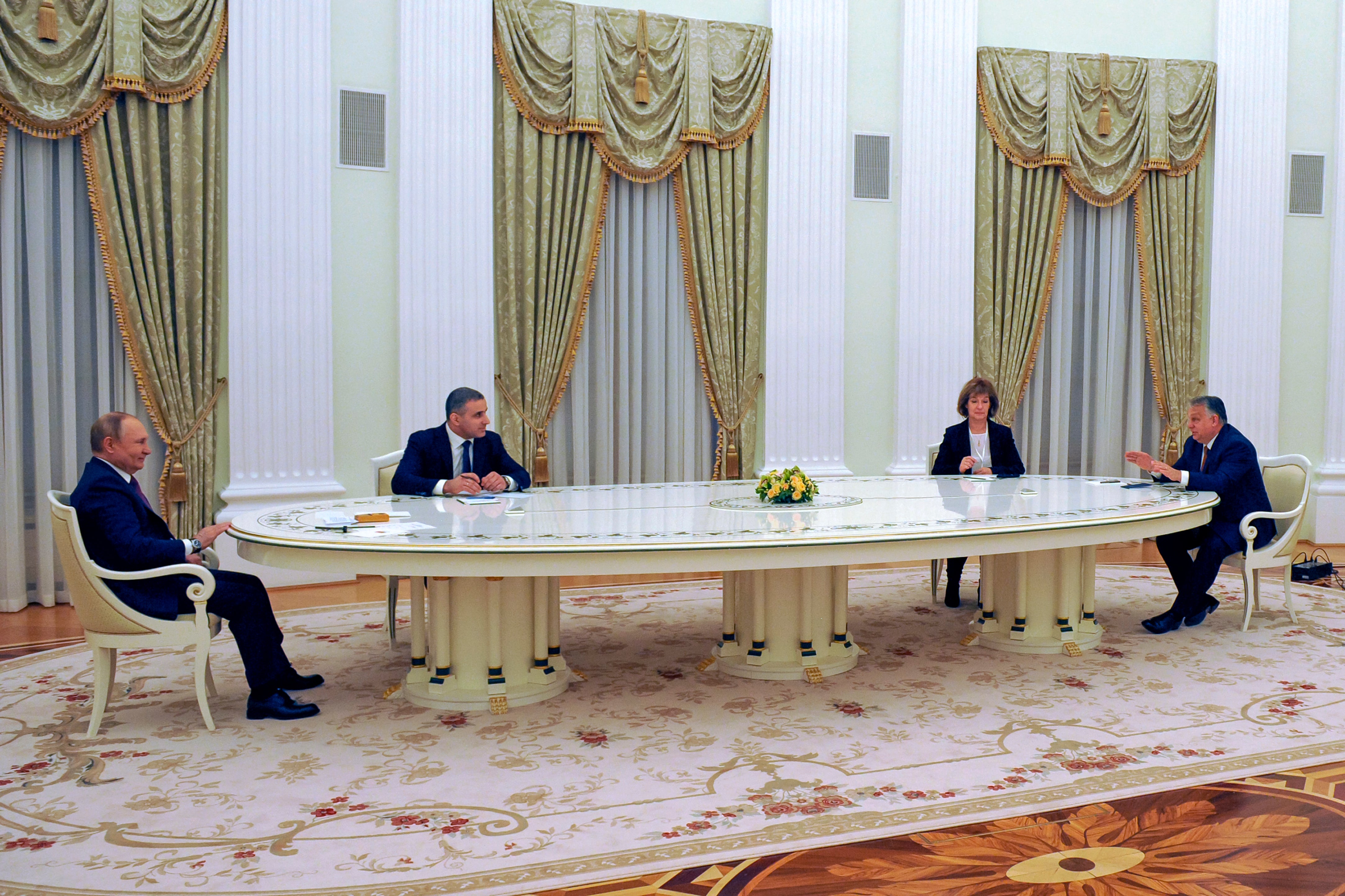 Russian President Vladimir Putin, left, listens to Hungary’s Prime Minister Viktor Orban during their meeting in the Kremlin