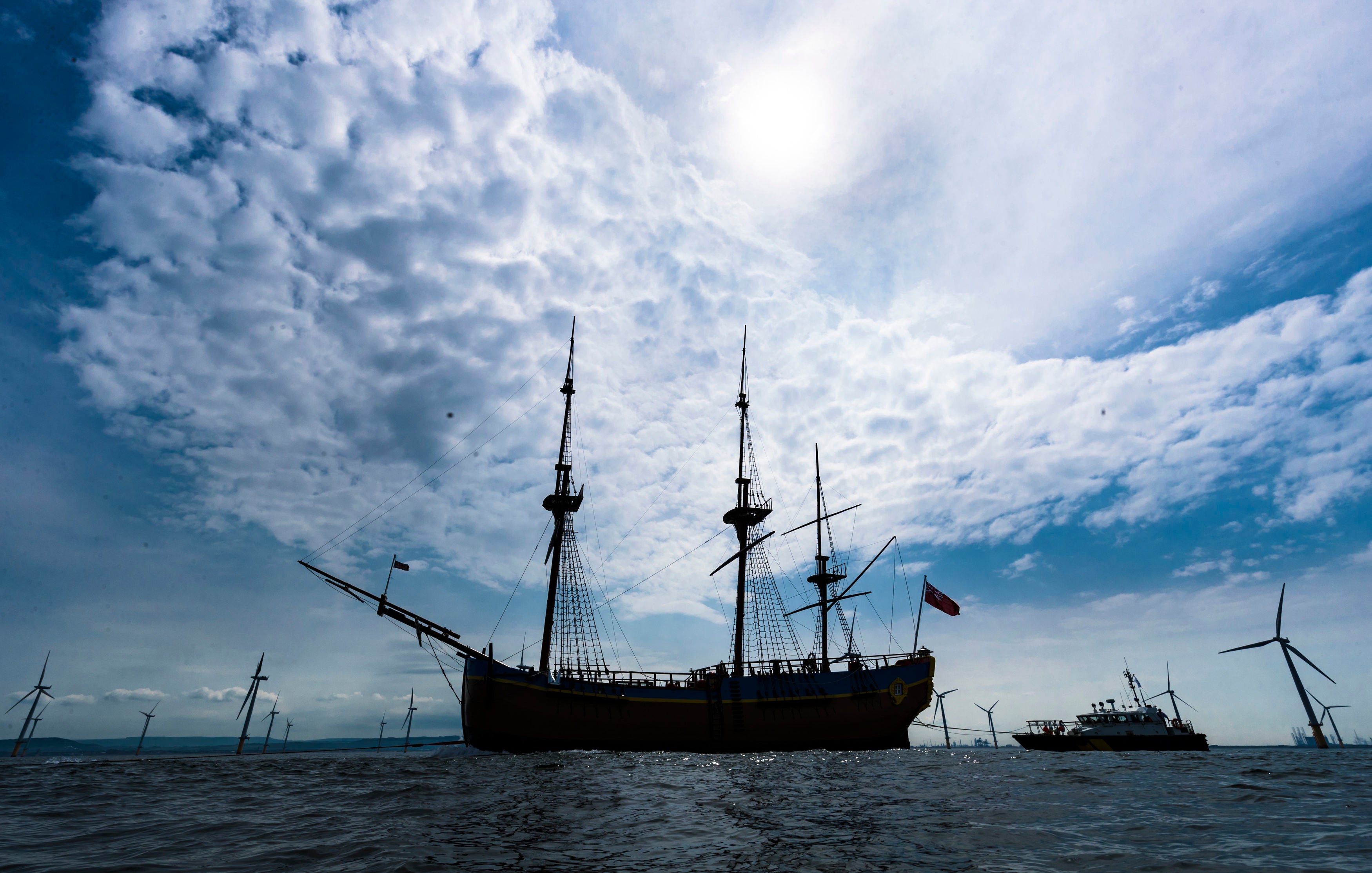 HM Bark Endeavour, a full-scale replica of Captain Cook’s ship, is pulled by a tugboat from Middlesbrough to its permanent home in Whitby