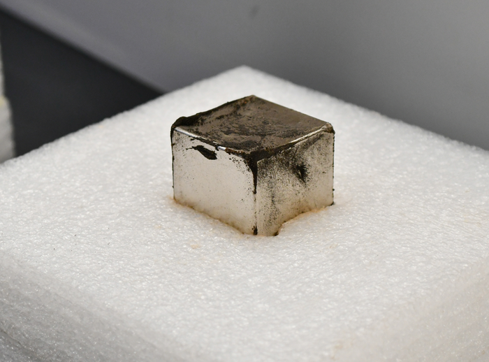 Magnet holds tiny micrometeorites collected from sediment samples taken from an ancient Hopewell site