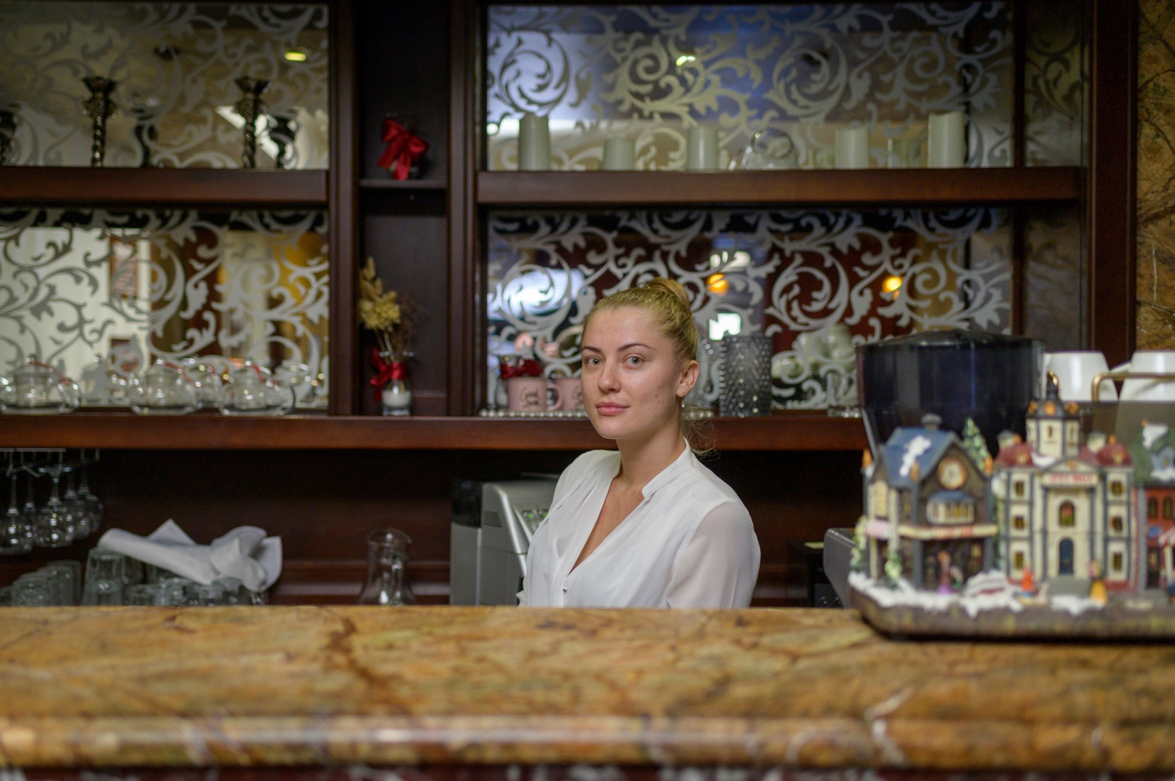 Irina Vershinyok, waitress and former teacher, at a restaurant in the Bordo Hotel in Kherson