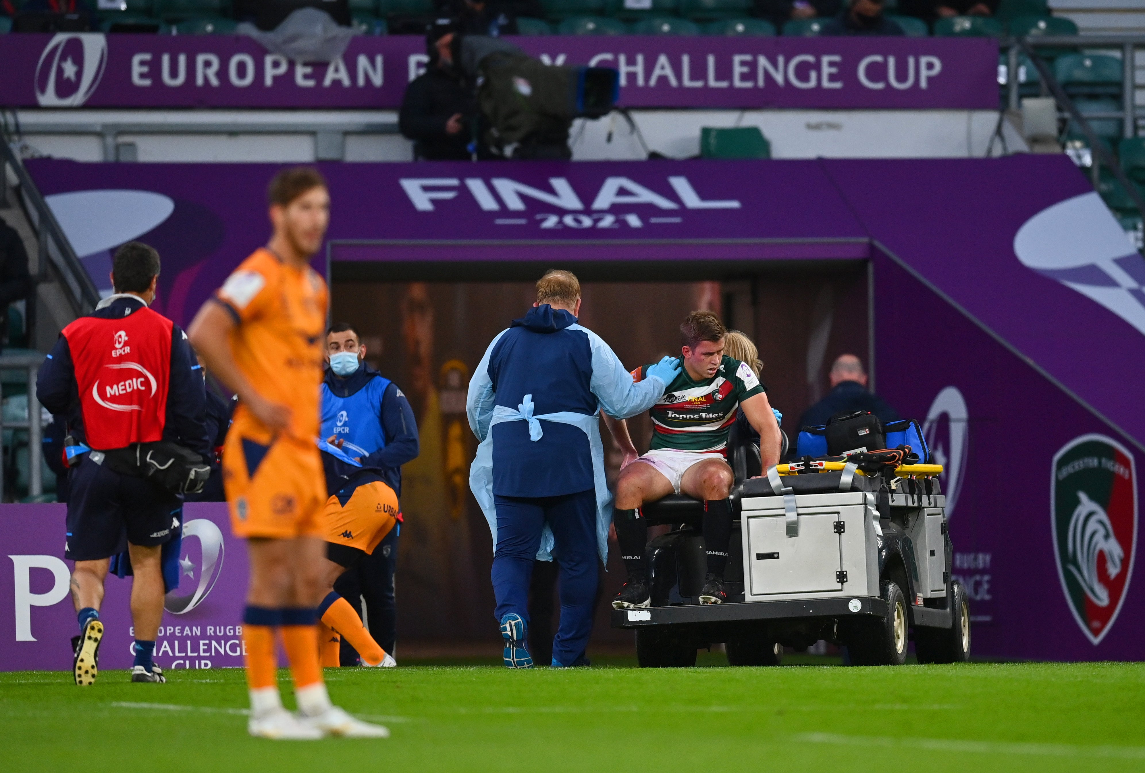 Guy Porter of Leicester Tigers is stretched off with a head injury during the ERC Cup final against Montpellier at Twickenham on 21 May 2021