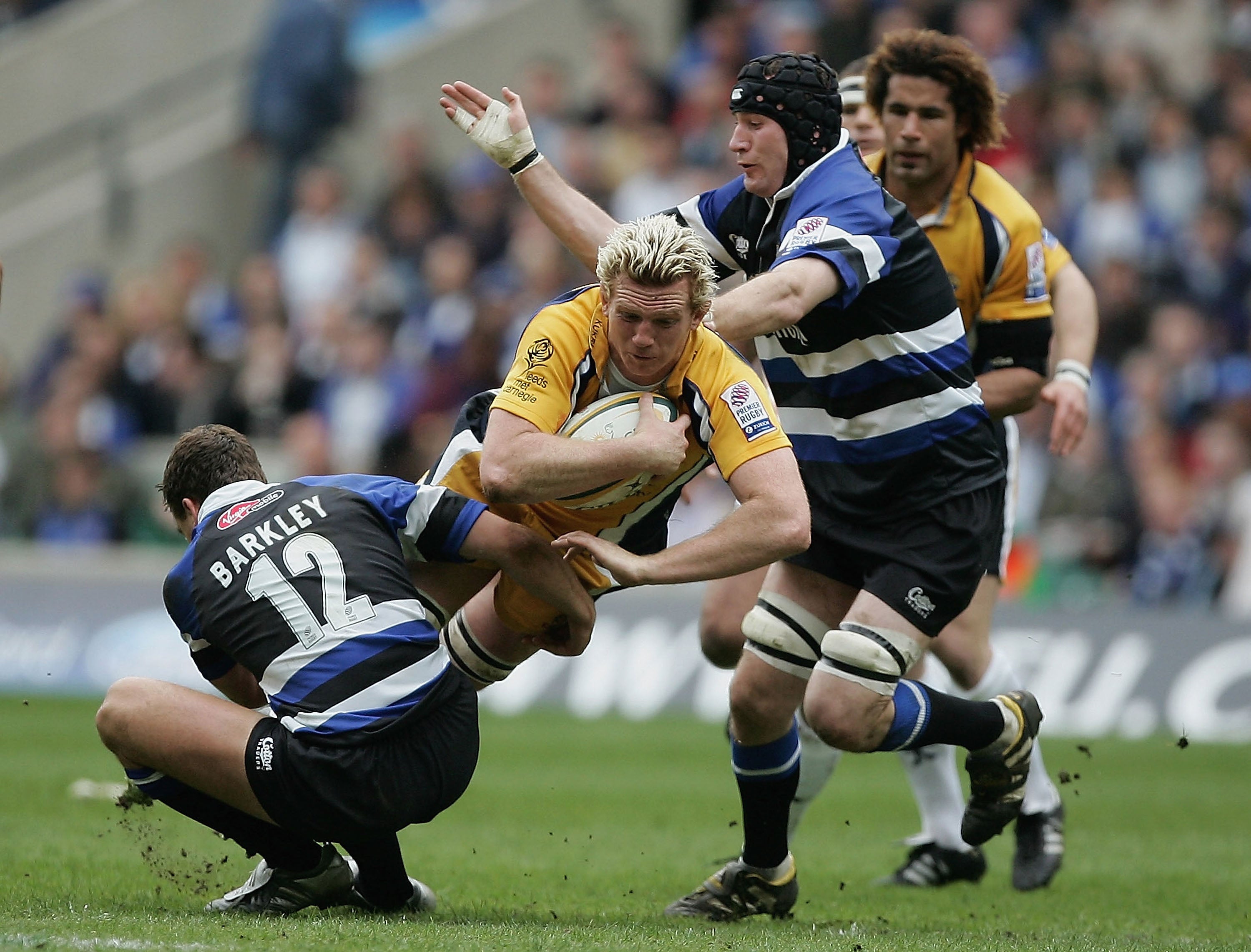 Leeds Tykes forward Popham is stopped by Olly Barkley and Geraint Lewis of Bath during the Powergen Cup final at Twickenham on 16 April 2005