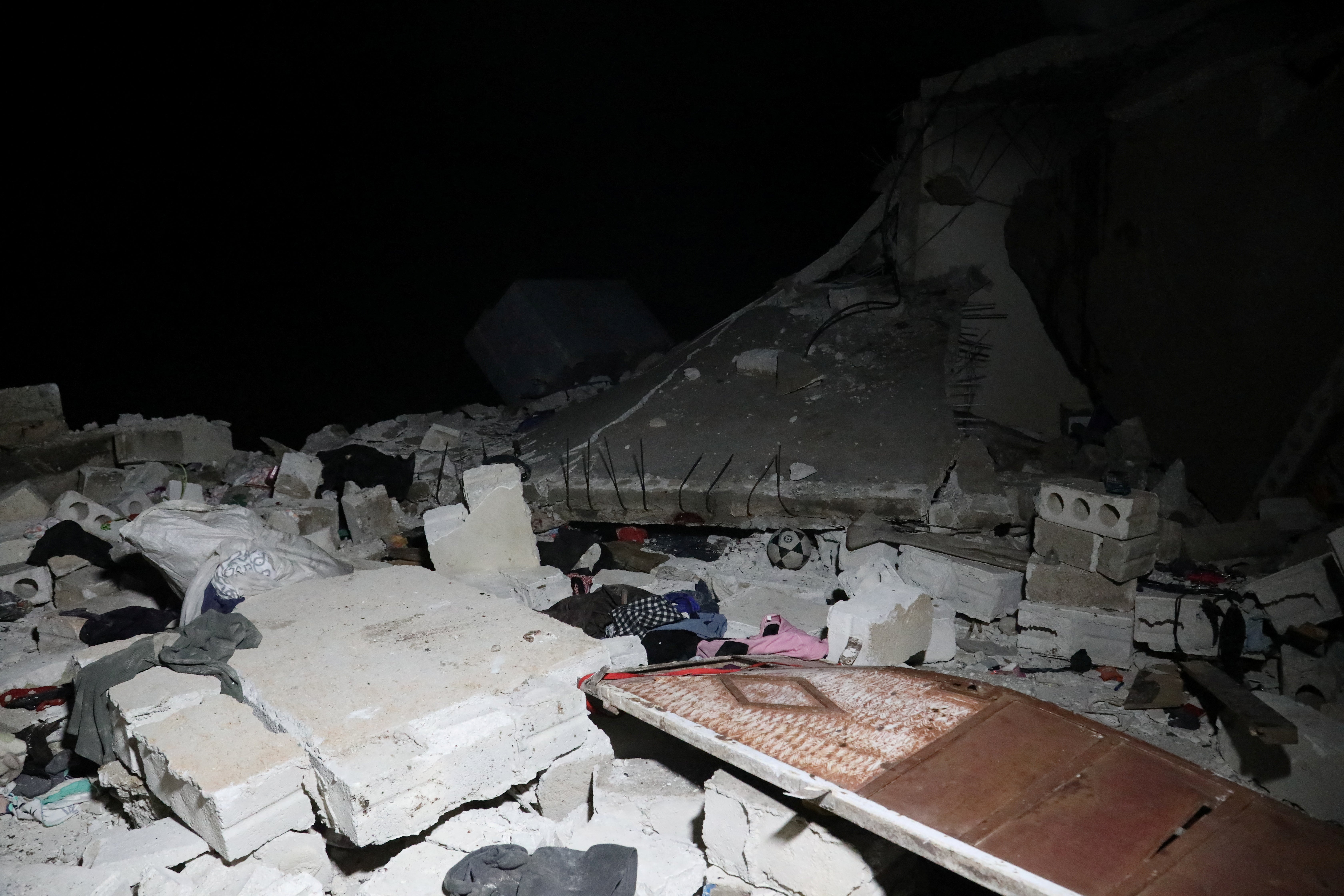 Debris and rubble are seen in the aftermath of a counter-terrorism mission conducted by the U.S. Special Operations Forces in Atmeh, Syria, February 3, 2022