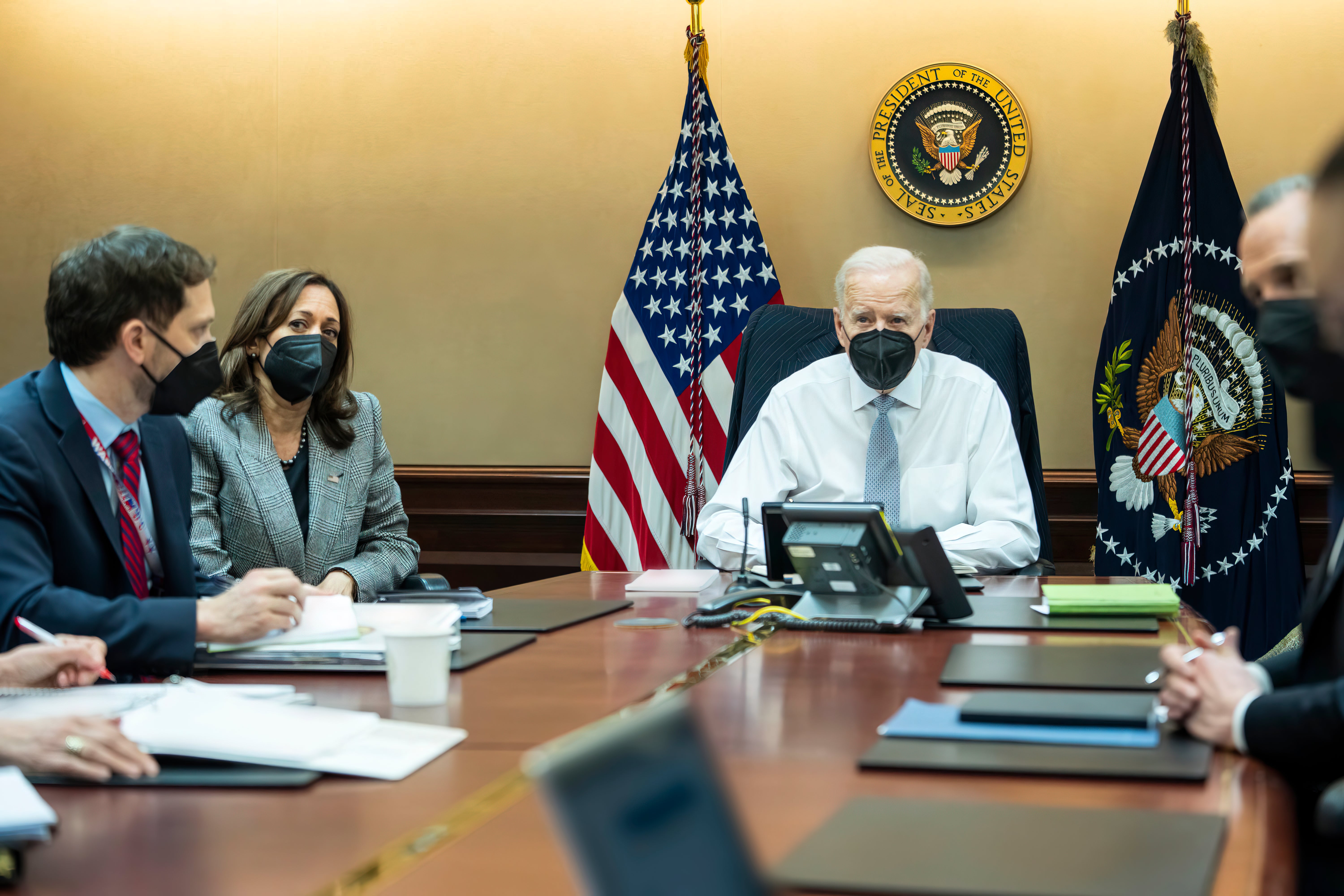 In this image provided by The White House, President Joe Biden and Vice President Kamala Harris and members of the President's national security team observe from the Situation Room at the White House in Washington, on Wednesday, Feb. 2, 2022