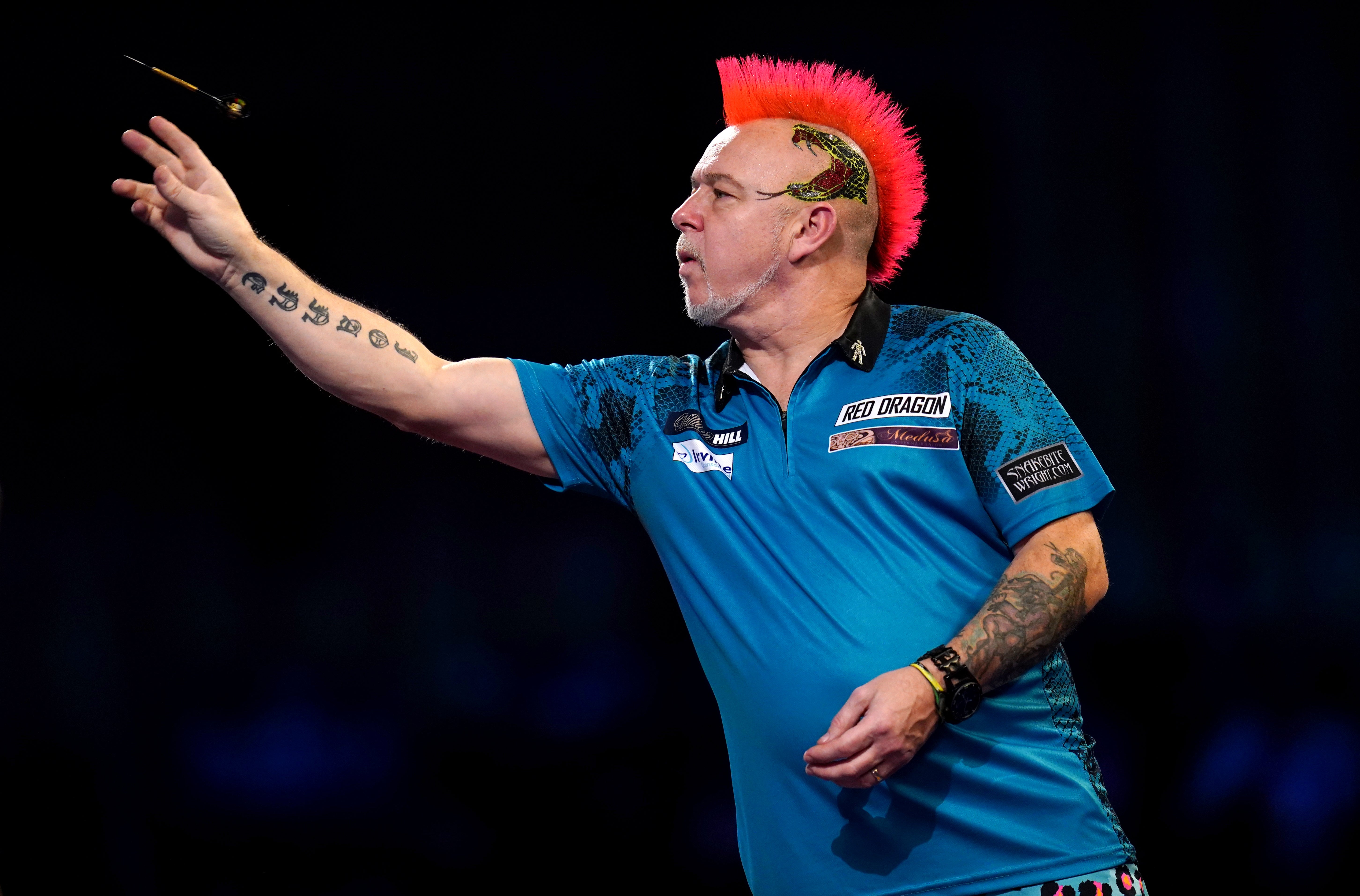 Peter Wright won the first night of Premier League action (John Walton/PA)