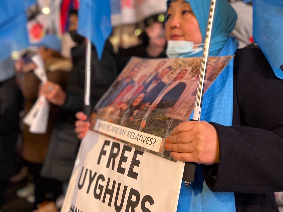 An Uyghur protester attends the demonstration in London