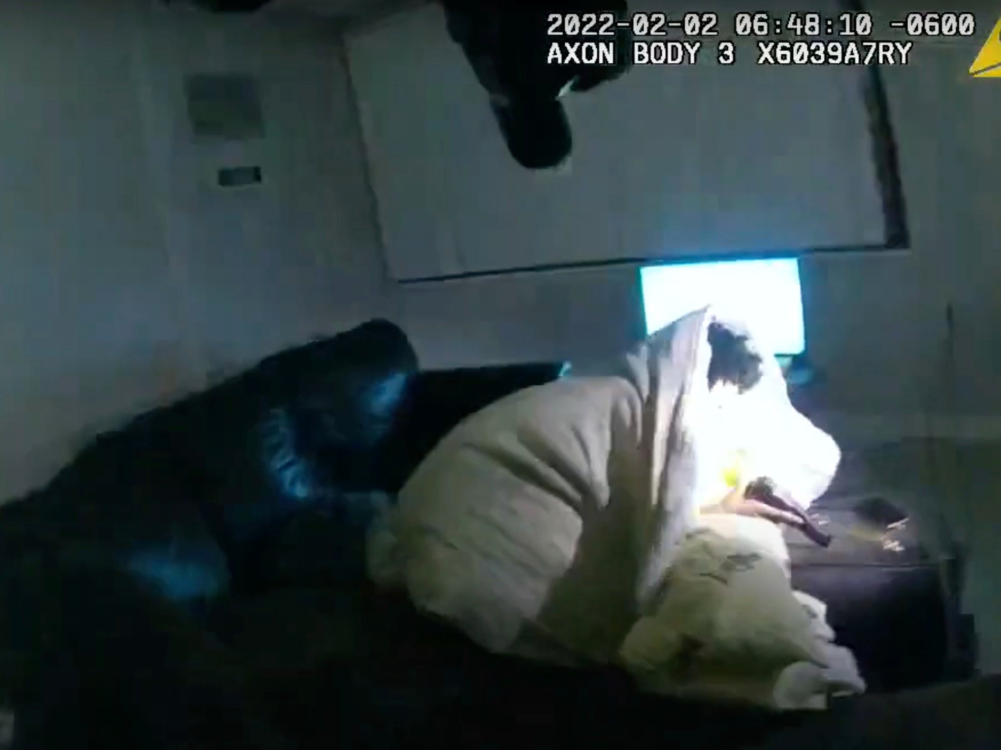 Body camera video shows 22-year-old Amir Locke wrapped in a blanket on a couch holding a gun moments before he was shot by Minneapolis police on Wednesday, Feb 2, 2022