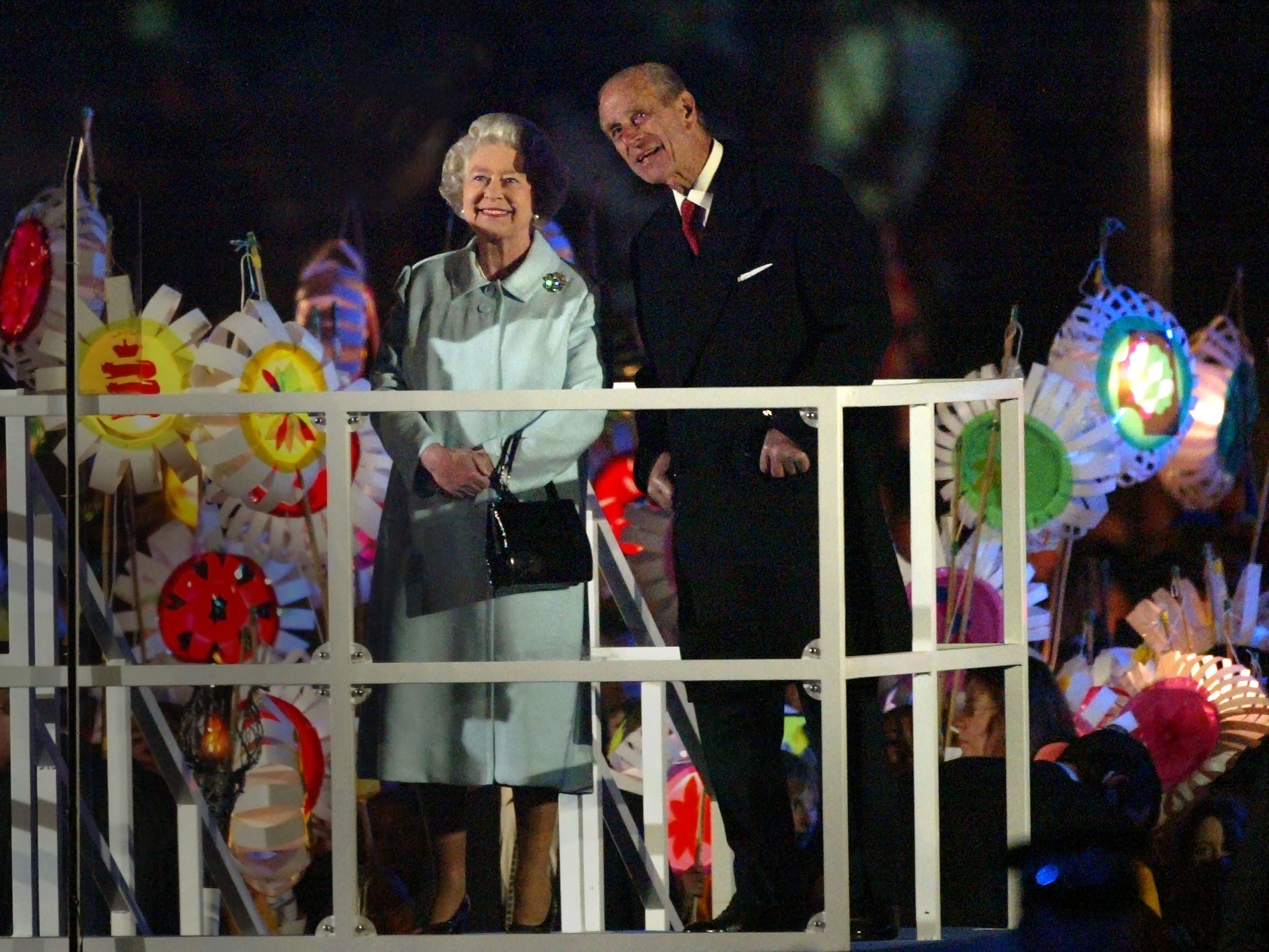 Queen Elizabeth II and her husband Prince Philip, the Duke of Edinburgh watch a fireworks display to celebrate her Golden Jubilee at Buckingham Palace