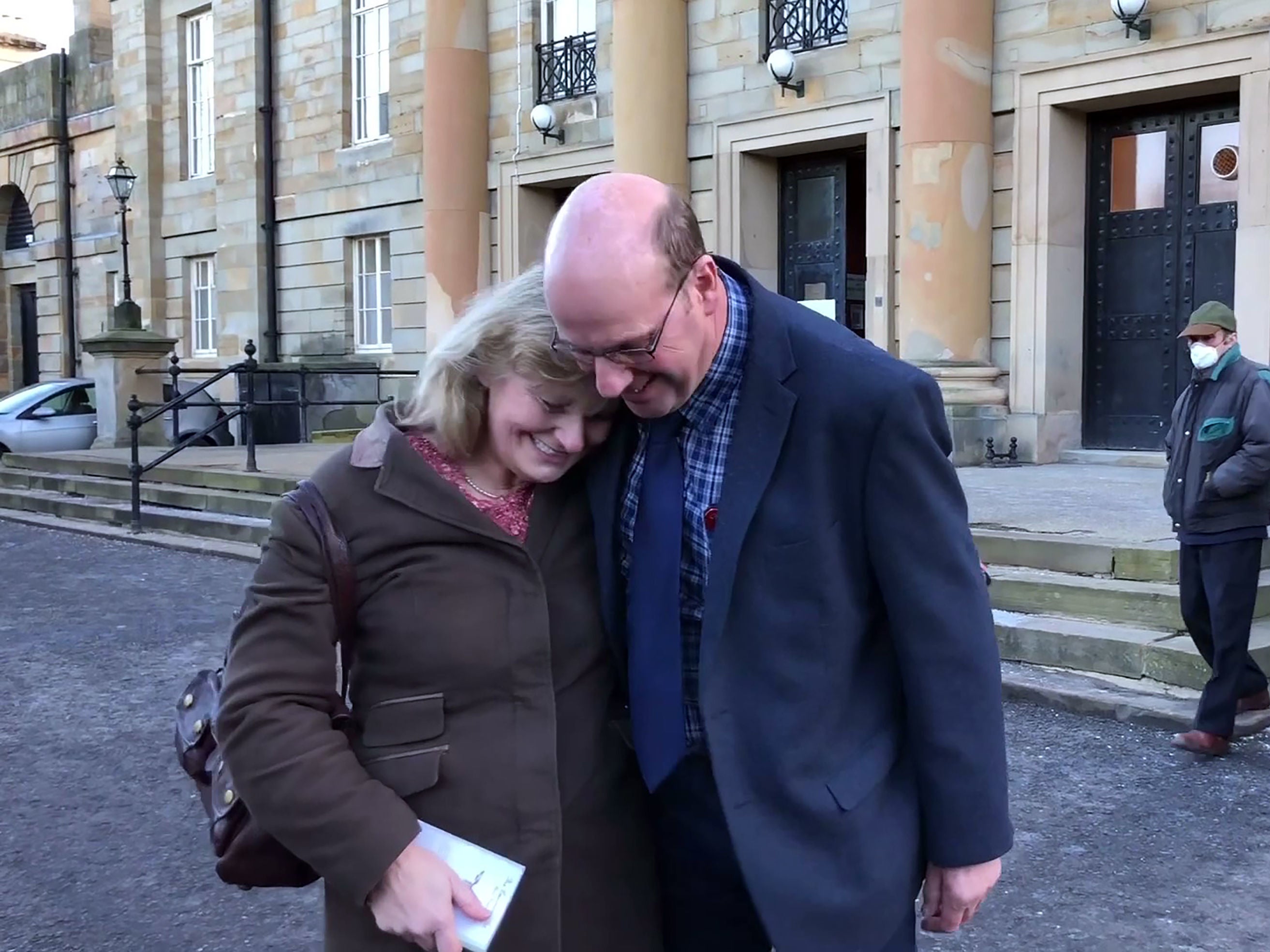 Robert Hooper with his partner Kate Henderson outside Durham Crown Court after being cleared of dangerous driving and criminal damage