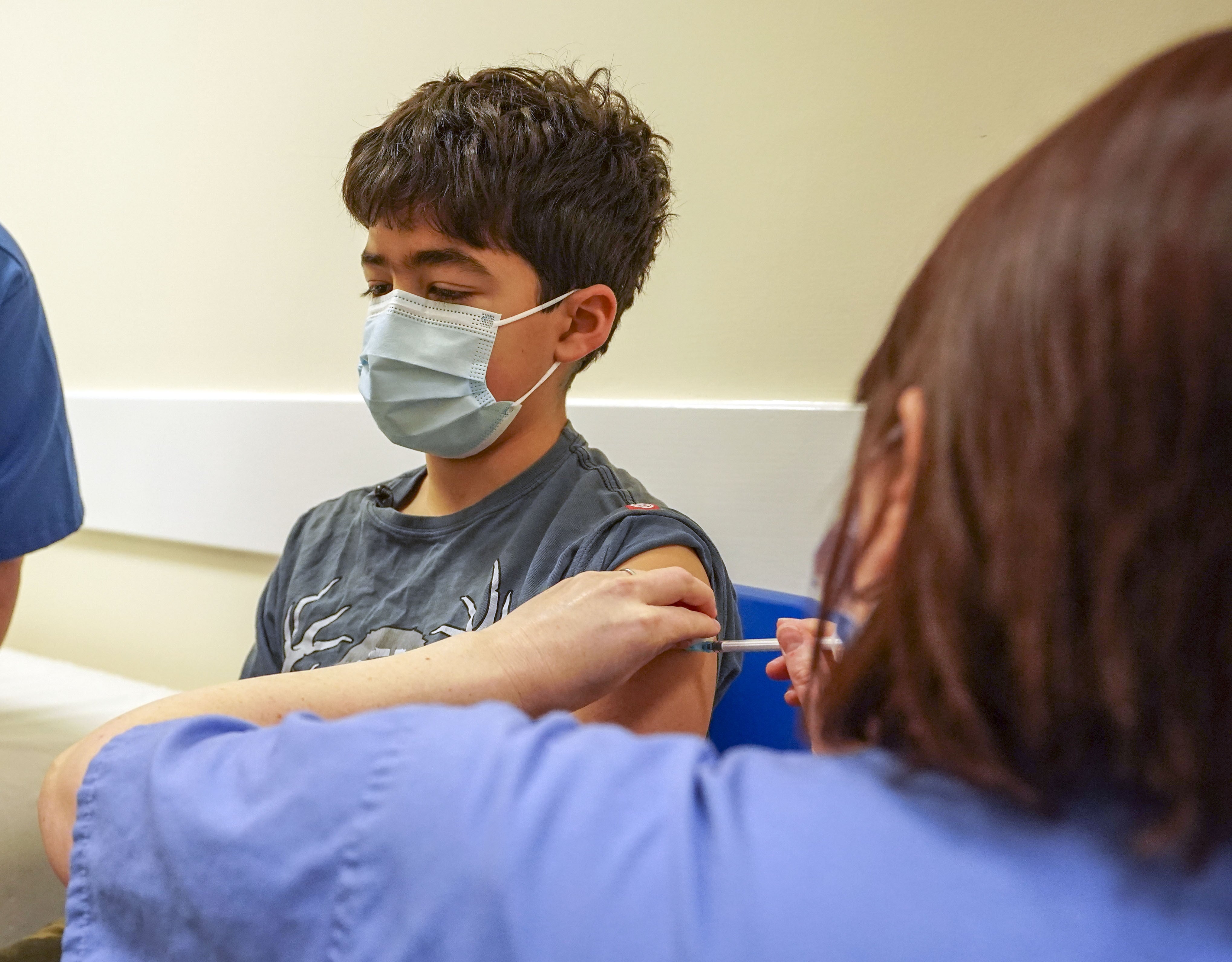 Xavier Aquilina, aged 11, has a Covid-19 vaccination at the Emberbrook Community Centre in Thames Ditton, Surrey (Steve Parsons/PA)