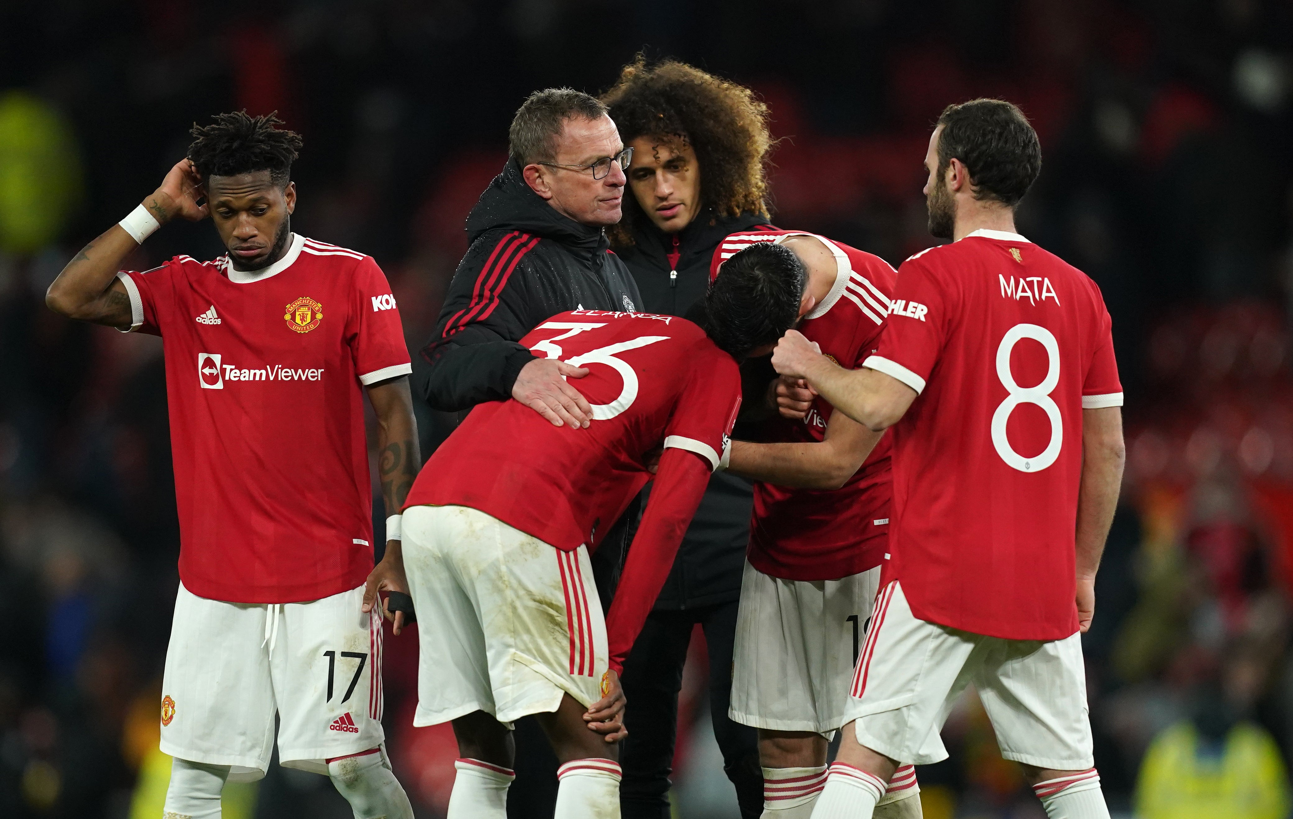 United’s Anthony Elanga is consoled by teammates and manager Ralf Rangnick after missing the decisive penalty