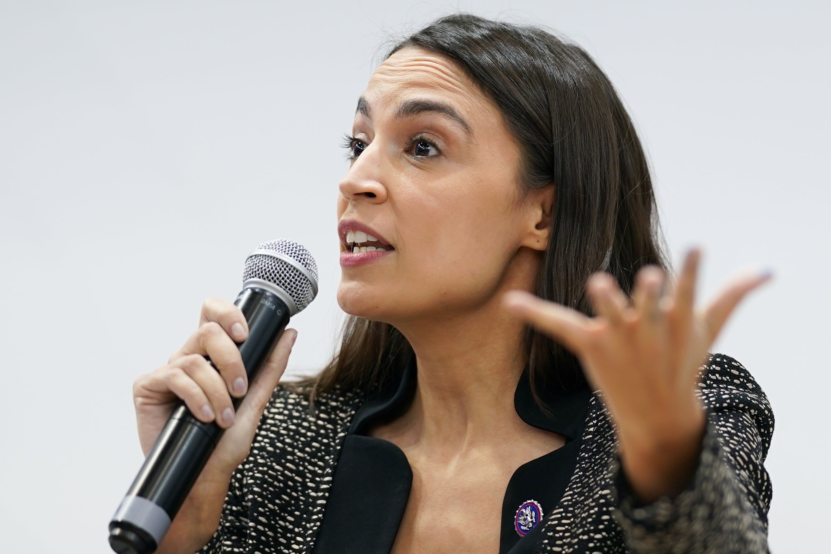 AOC is seen speaking at the US Climate Action Centre during COP26 in November