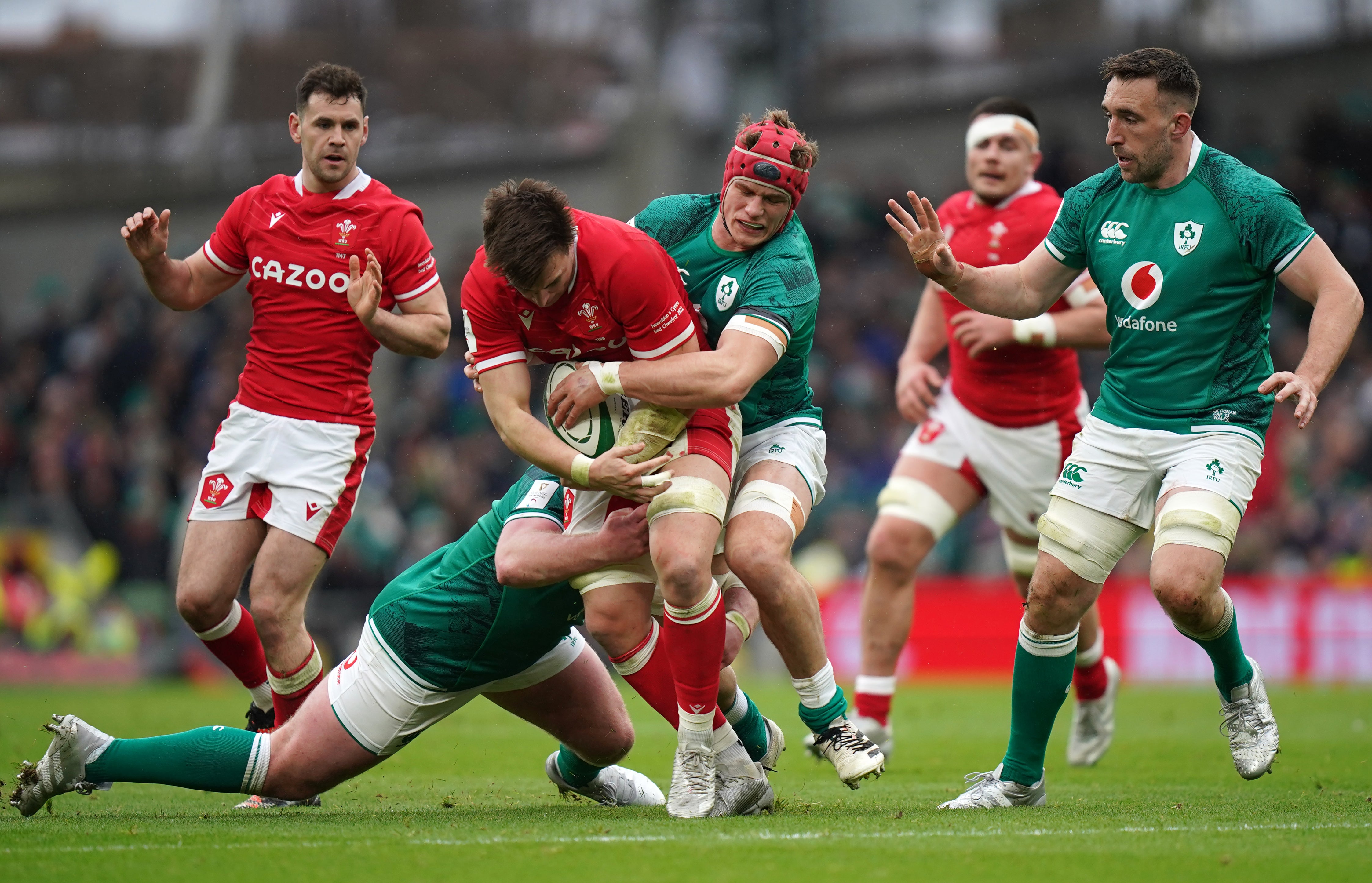 Taine Basham, pictured centre being tackled by Ireland’s Josh Van Der Flier, scored Wales’ only try in the 29-7 defeat against Ireland (Niall Carson/PA Images).