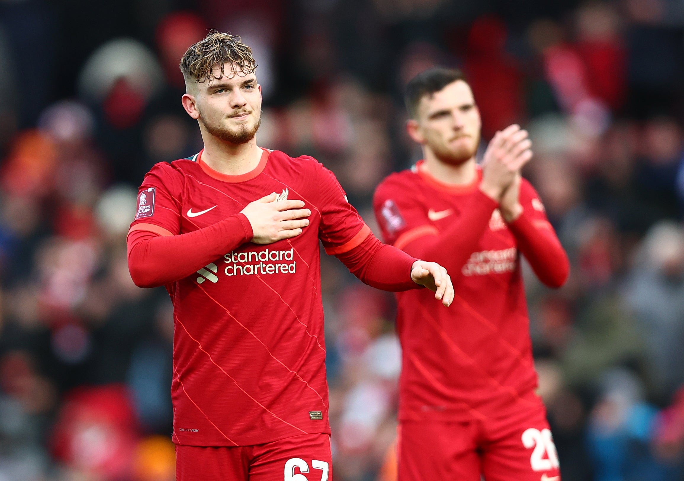 Elliott and teammate Andrew Robertson acknowledge the fans after the fourth-round victory