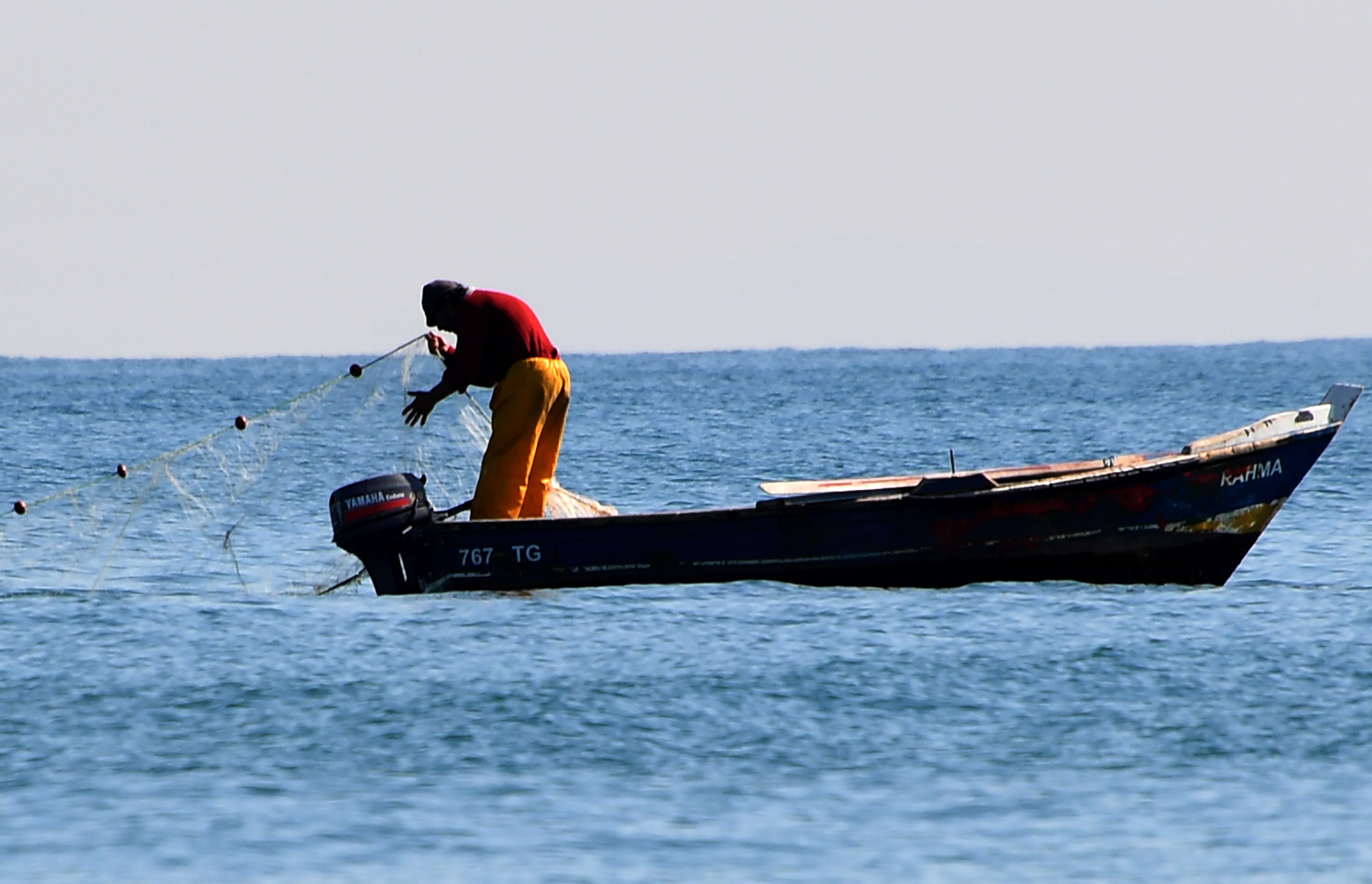 File photo: A Tunisian fisherman fishes in the sea in Tunis, 20 February 2017