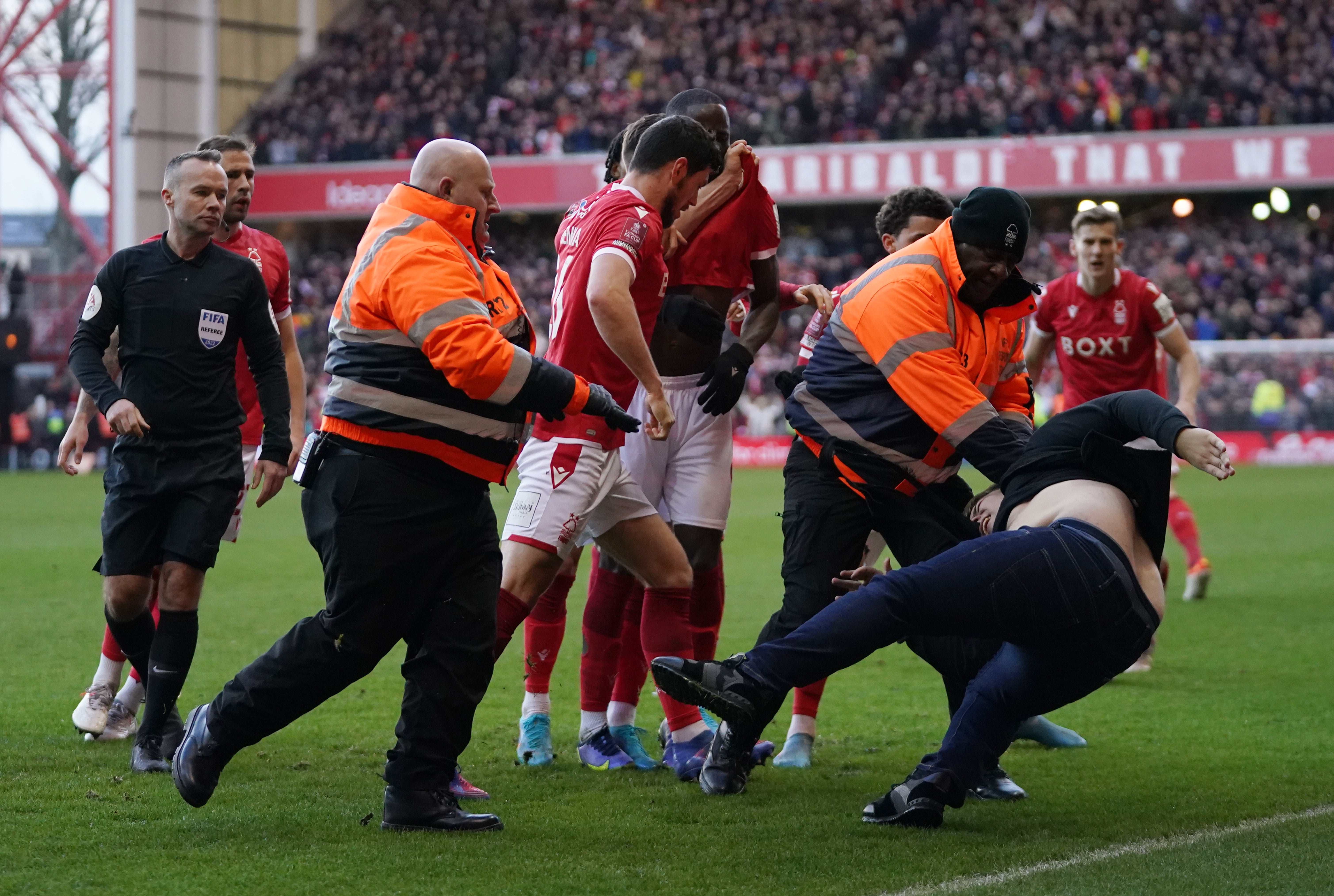 A Leicester fan had to be dragged away from celebrating Nottingham Forest players (Tim Goode/PA)