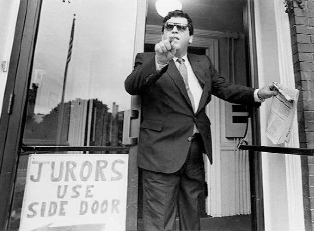 An angry Kenneth Ponte stops on the courthouse steps on his way into the courthouse where the murder charge was to be dropped to swear at a StandardTimes news photographer (Standard-Times photo by Jack Iddon)