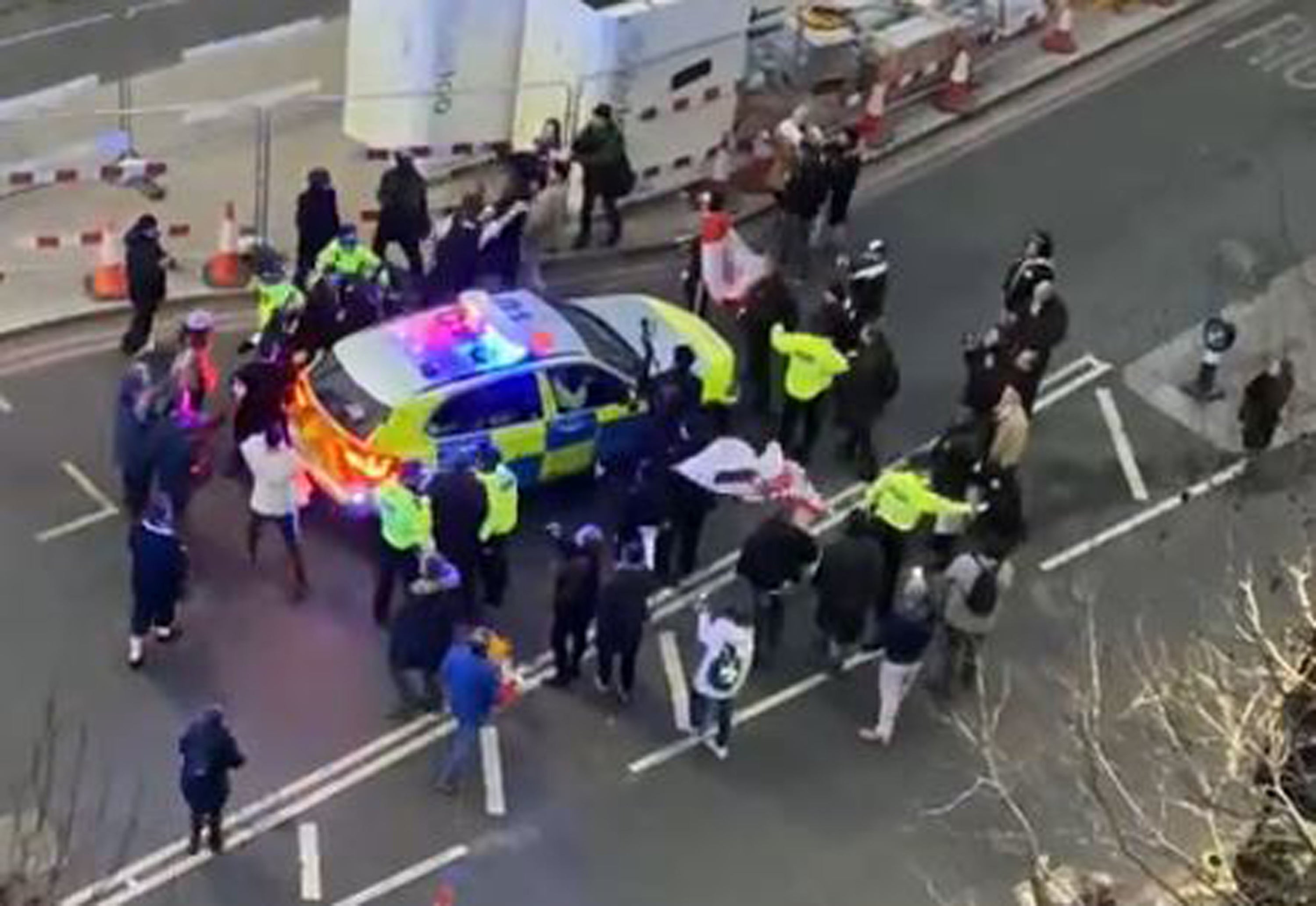 Officers use a police vehicle to escort Labour leader Sir Keir Starmer to safety (Conor Noon/PA)