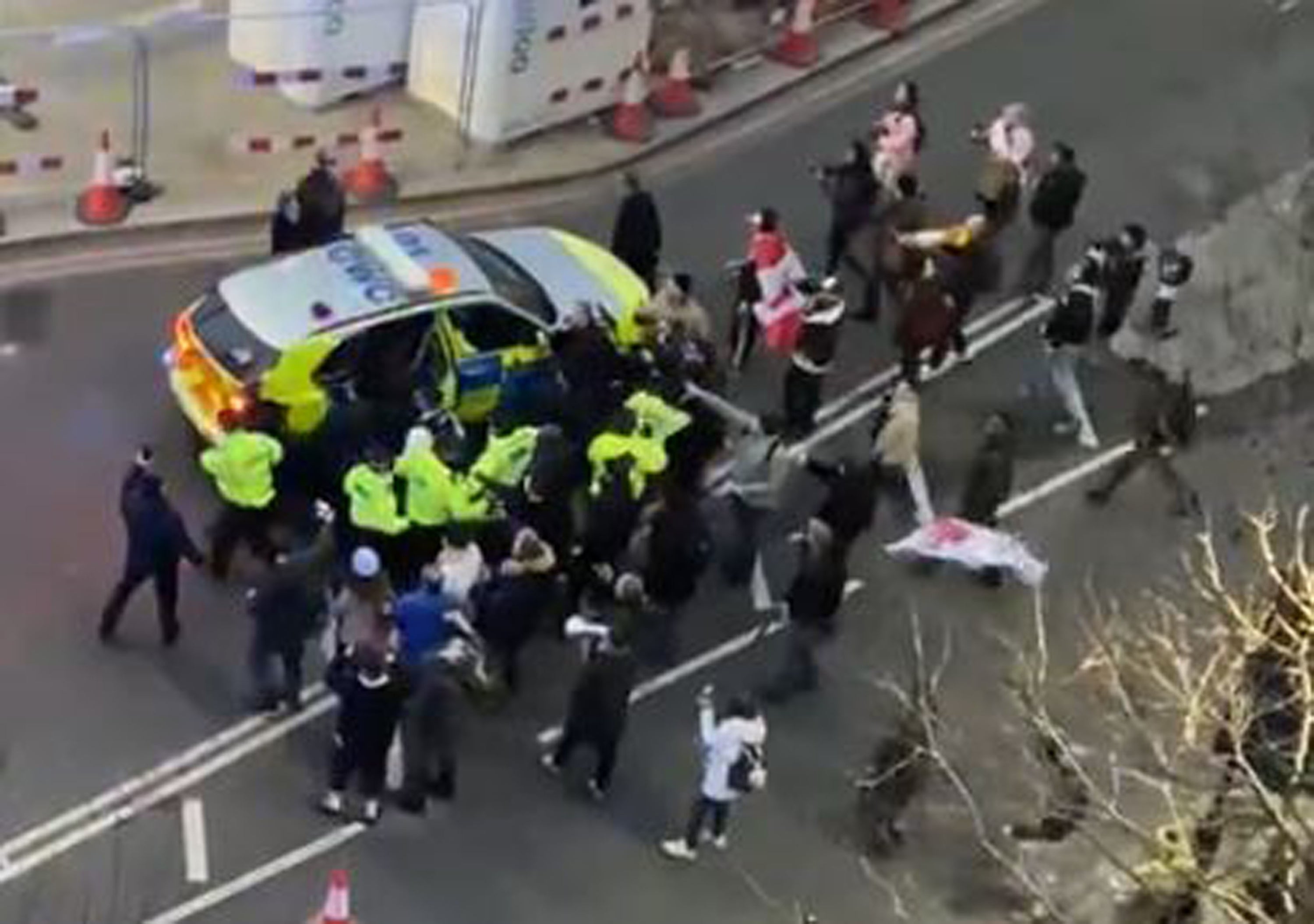 Police and protesters clash in Westminster as officers use a police vehicle to escort Labour leader Sir Keir Starmer to safety (Conor Noon/PA)