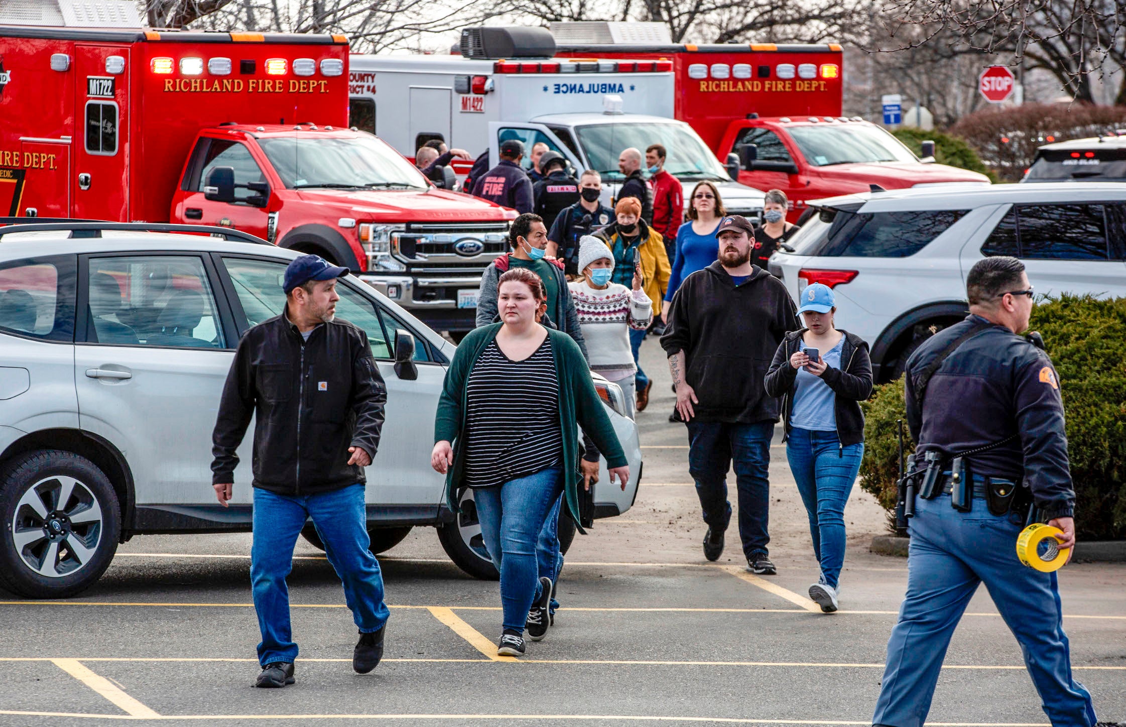 Customers and staff are evacuated from the store following the shooting