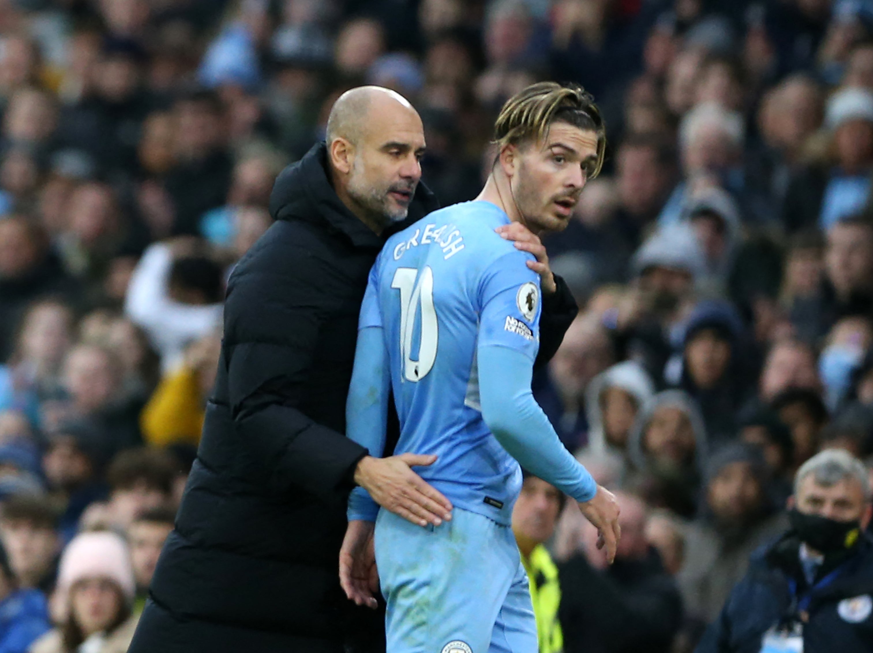 Manchester City manager Pep Guardiola and Jack Grealish