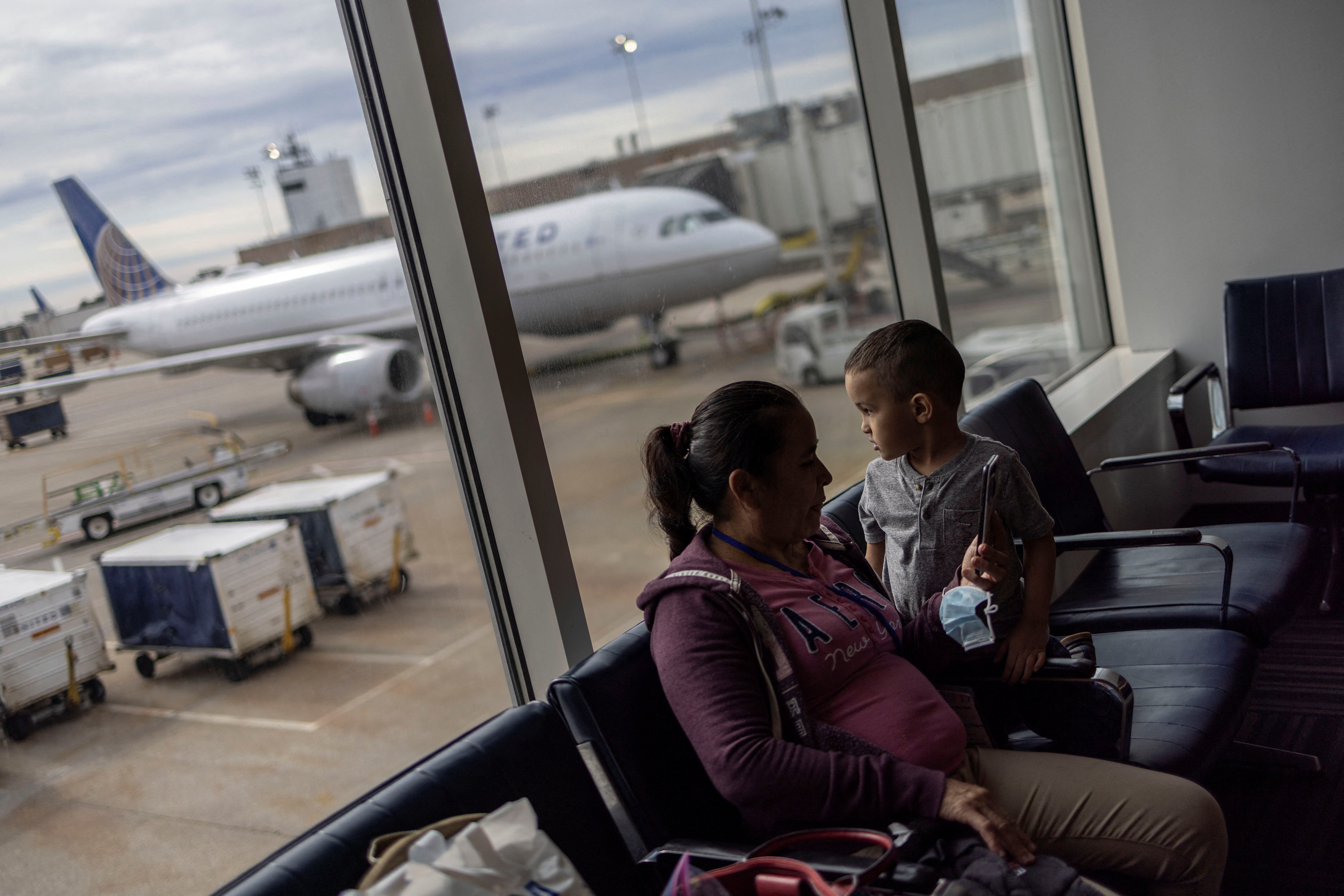 Maria and her grandson wait at Houston international airport before travelling to Los Angeles