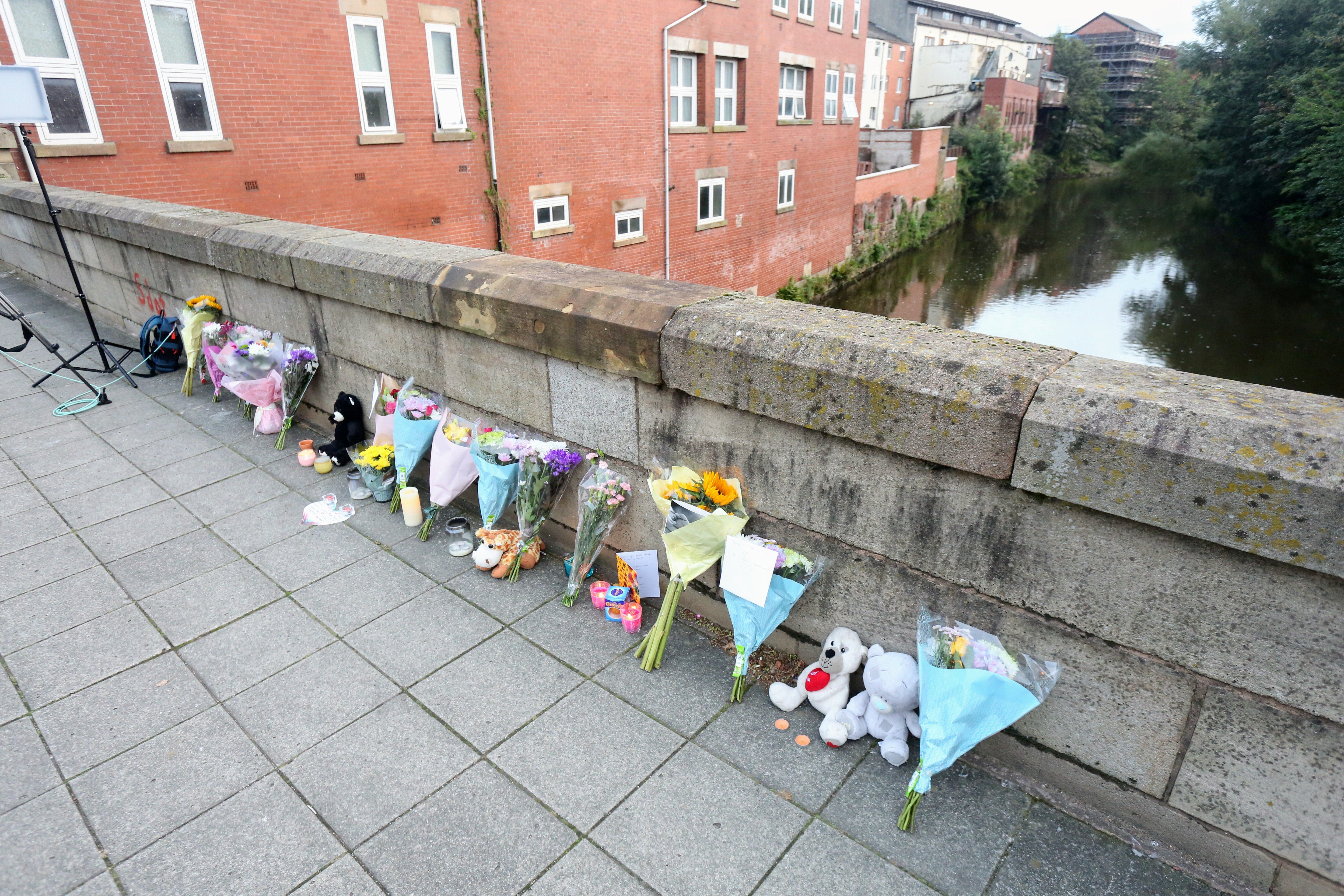 Tributes to Zakari line a bridge in Radcliffe town centre, Greater Manchester, over the River Irwell.