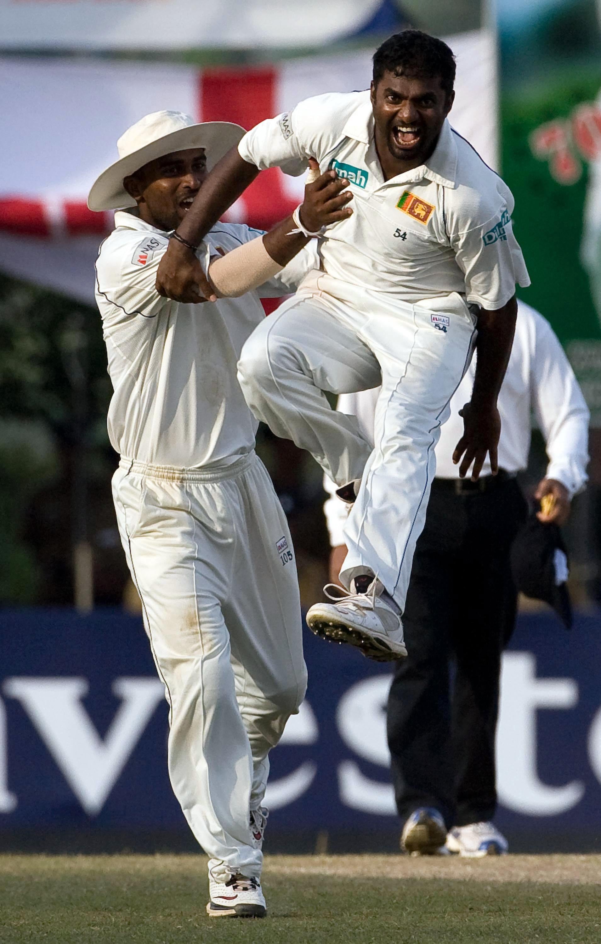 Muttiah Muralitharan, right, is the top wicket-taker in Test history (Gareth Copley/PA)