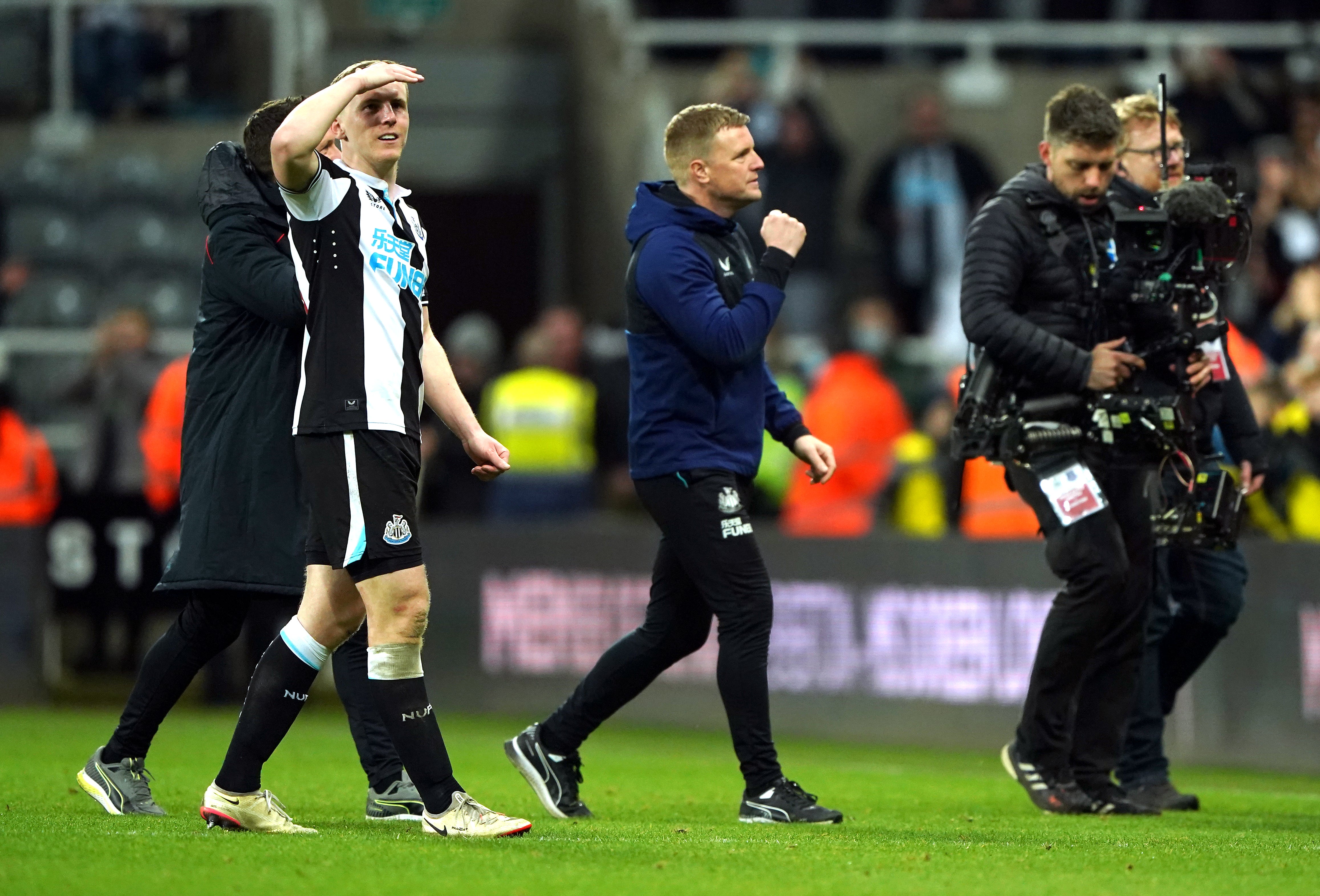 Eddie Howe, centre, is keeping his feet on the ground after back-to-back wins (Owen Humphreys/PA)