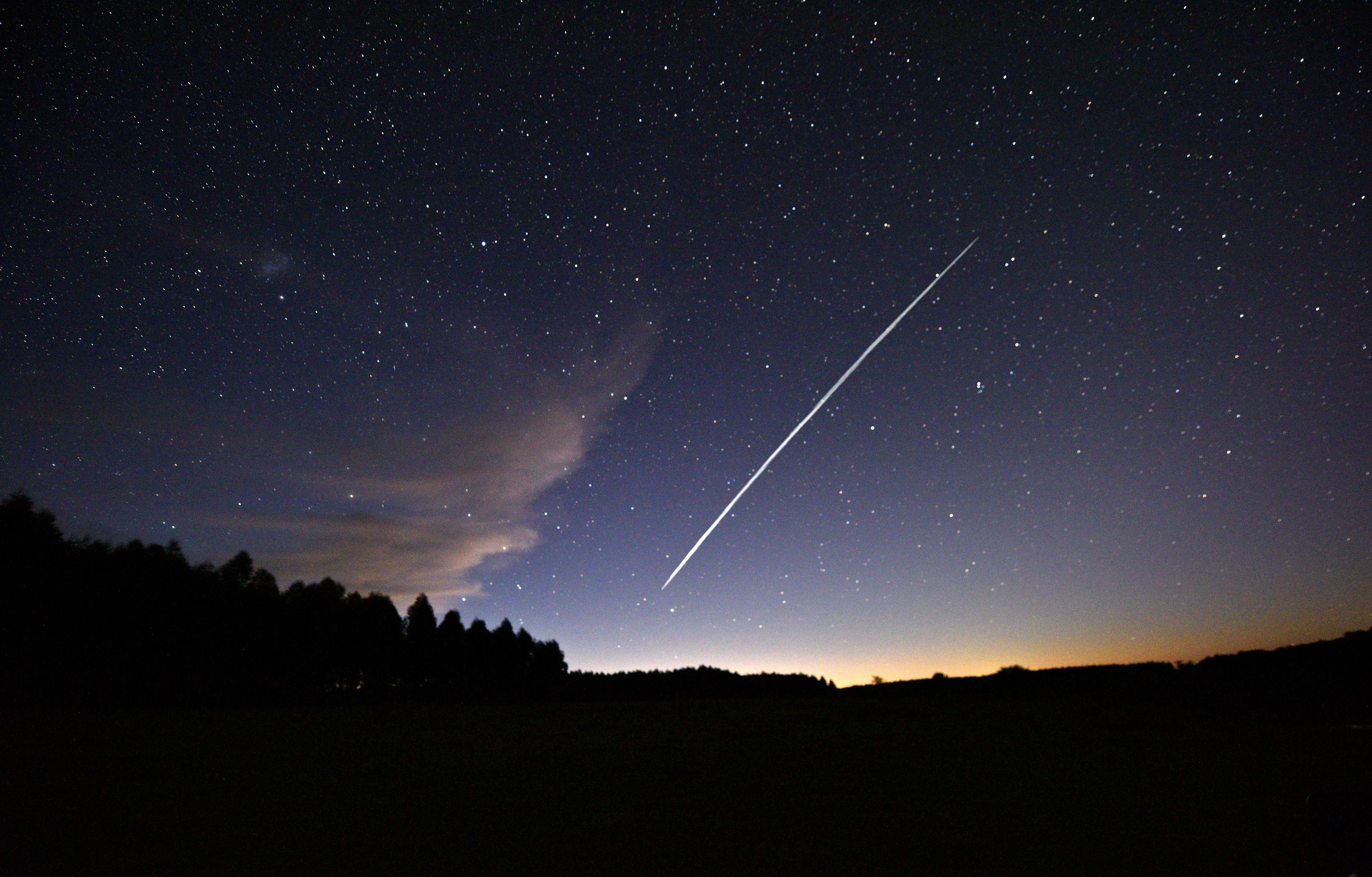 Long-exposure image shows a trail of a group of SpaceX’s Starlink satellites passing over Uruguay on February 7, 2021