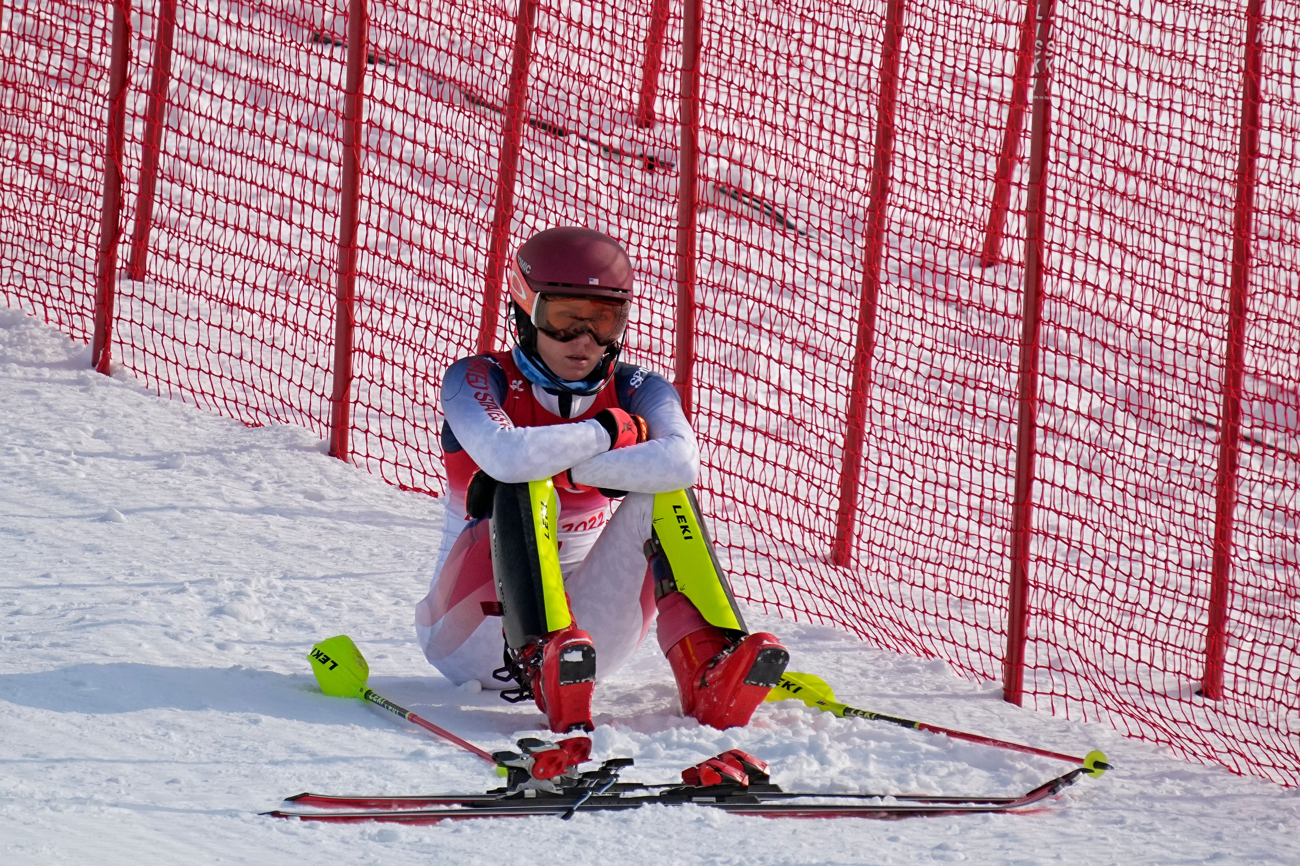 Mikaela Shiffrin, of the United States sits on the side of the course after skiing out in the first run of the women's slalom