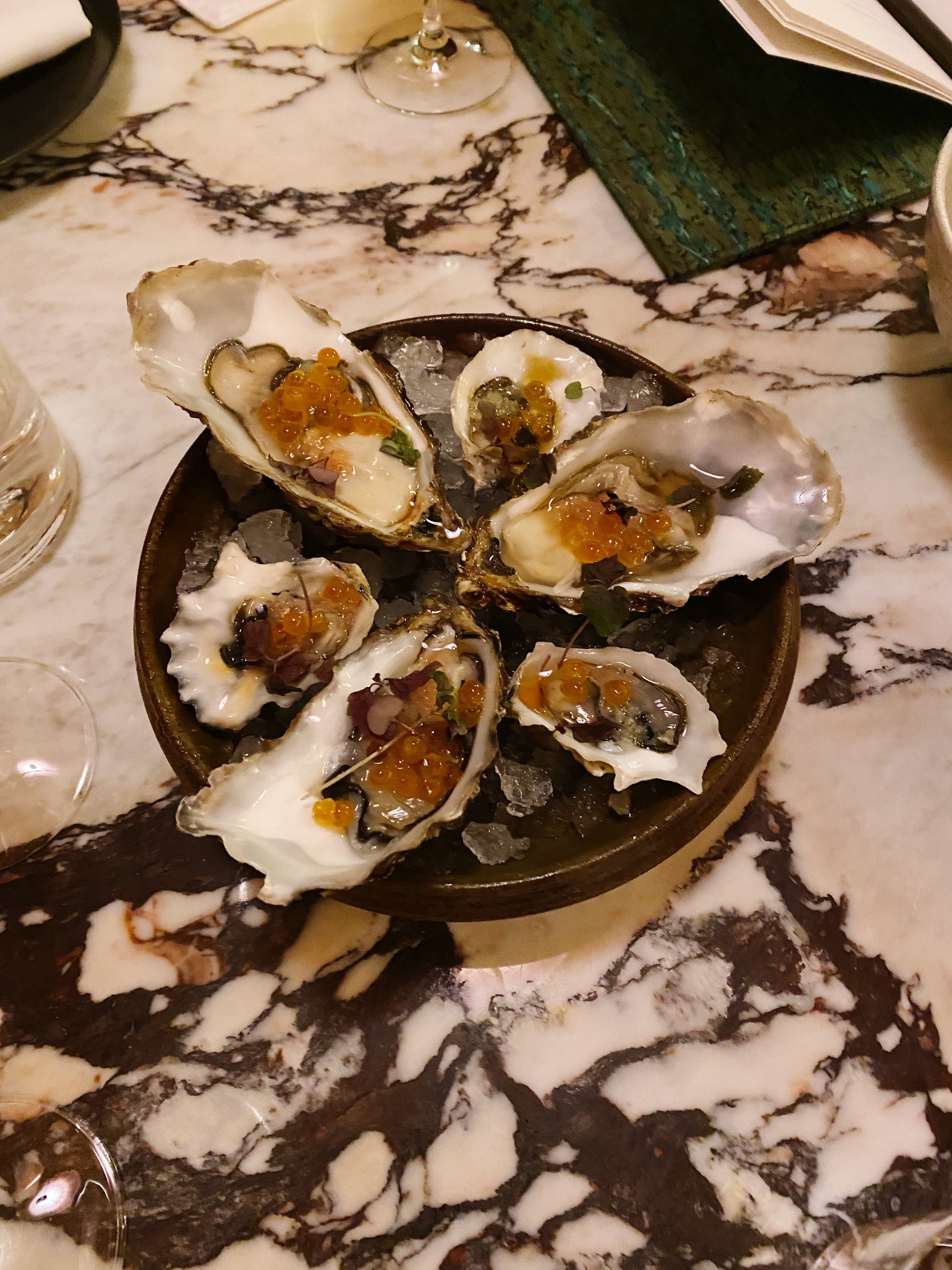 Oysters are dotted with bulbous cylinders of roe in a kind of saline inception