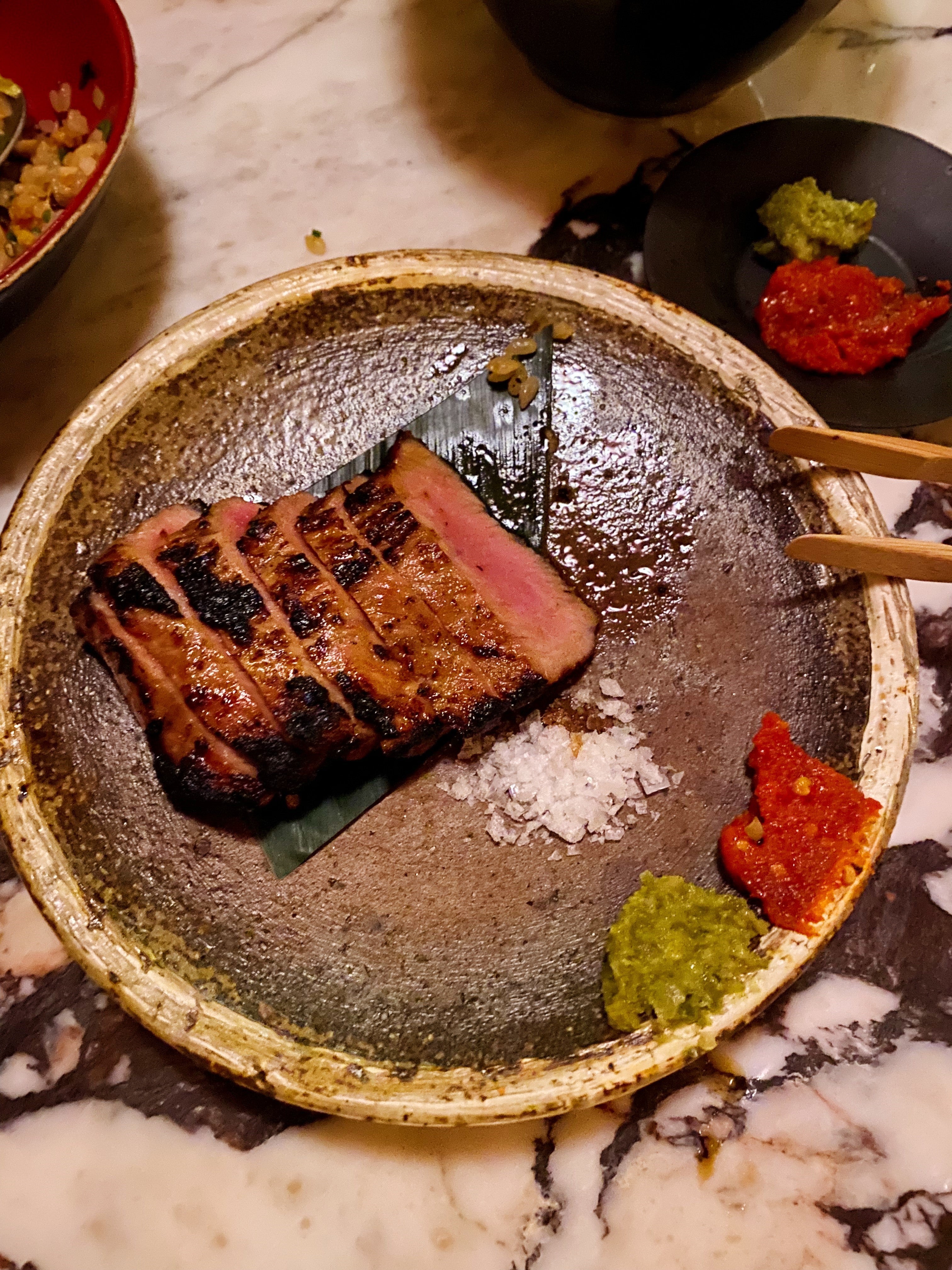 Iberico pork comes with a charred exterior and a punchy sambal-esque chilli sauce