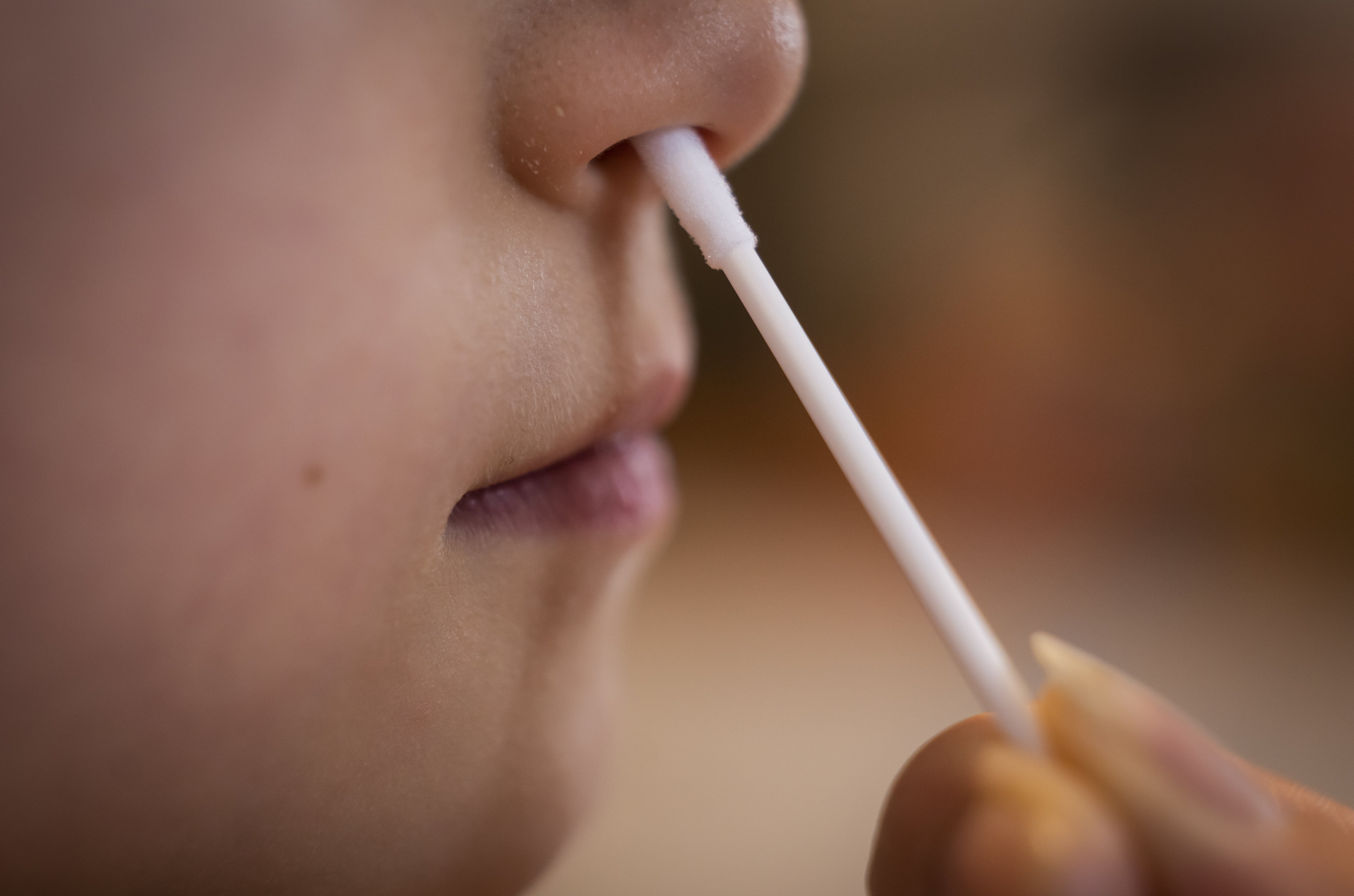 A child being given a Covid-19 test (Danny Lawson/PA)