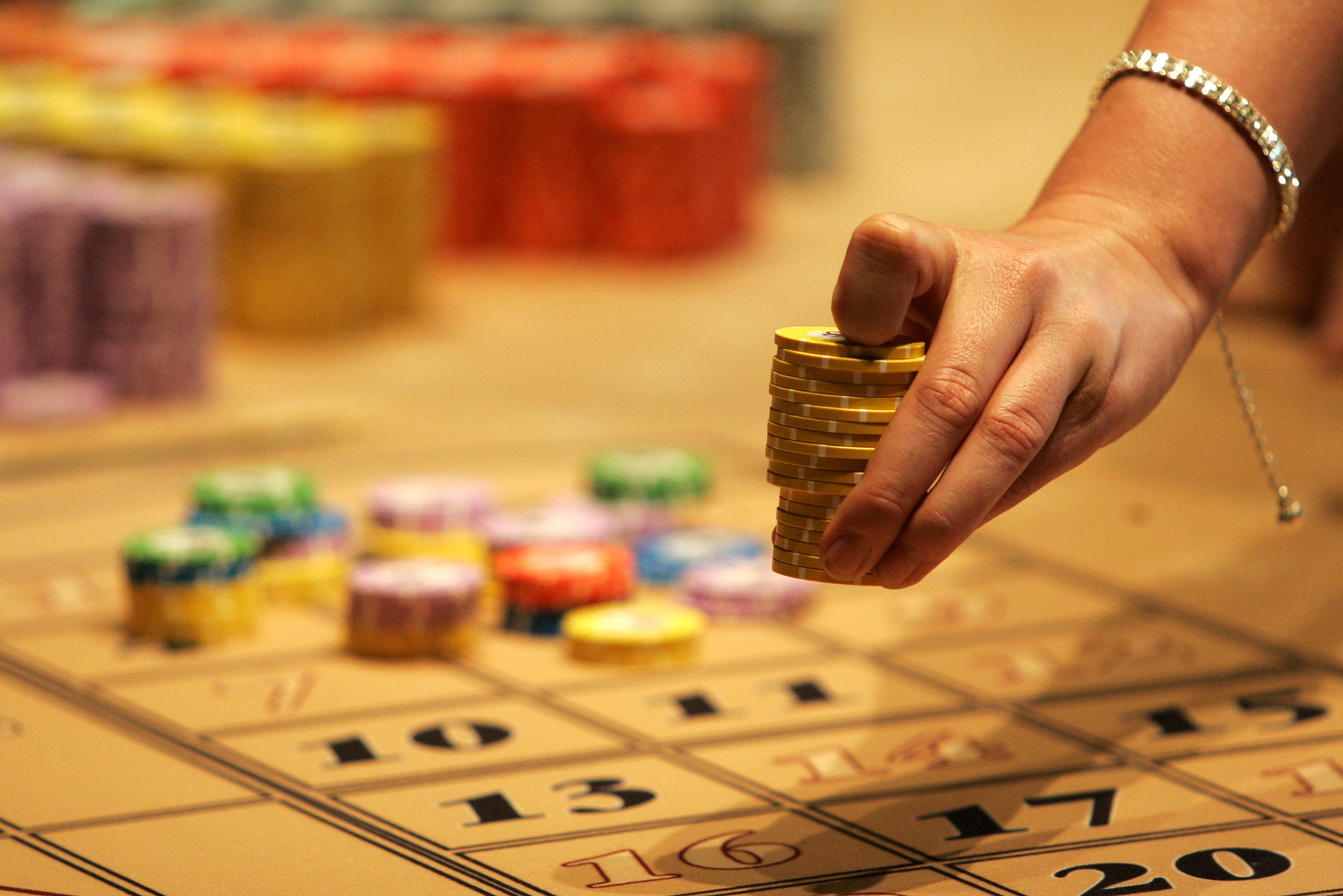 Men are five times more likely than women to be at risk of problem gambling, according to a new report (PA)