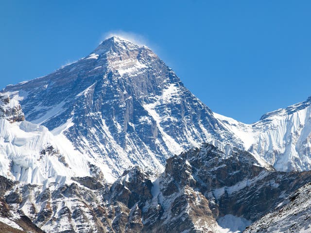 <p>Mount Everest’s summit, the wind-scoured southwest face and snowy pass of the South Col under deep blue high-altitude skies in the Himalayas</p>